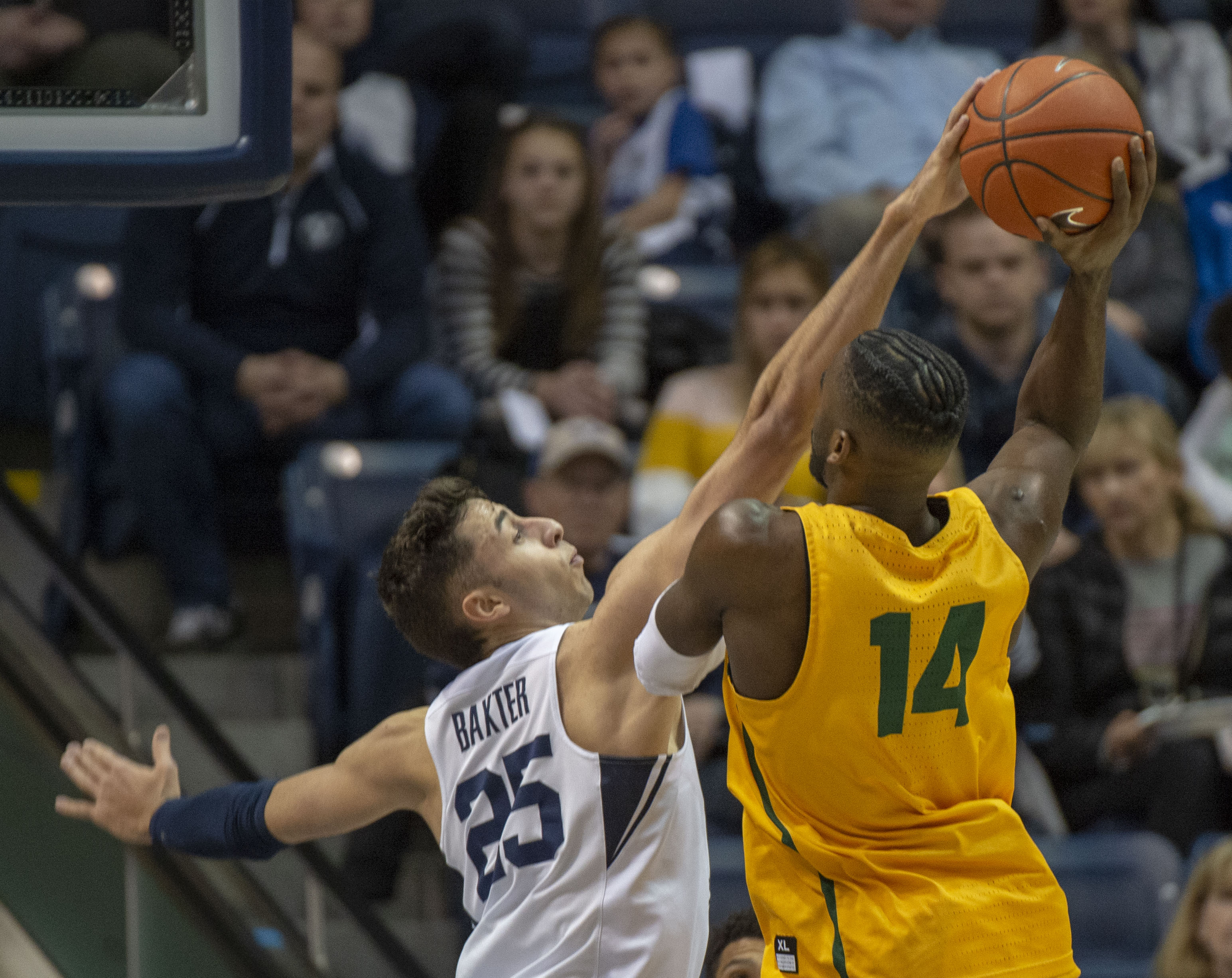 (Rick Egan | The Salt Lake Tribune) Brigham Young Cougars forward Gavin Baxter (25) blocks a shot by San Francisco Dons guard Charles Minlend (14), in WCC basketball action at the Marriott Center, Thursday, February 21, 2018. 