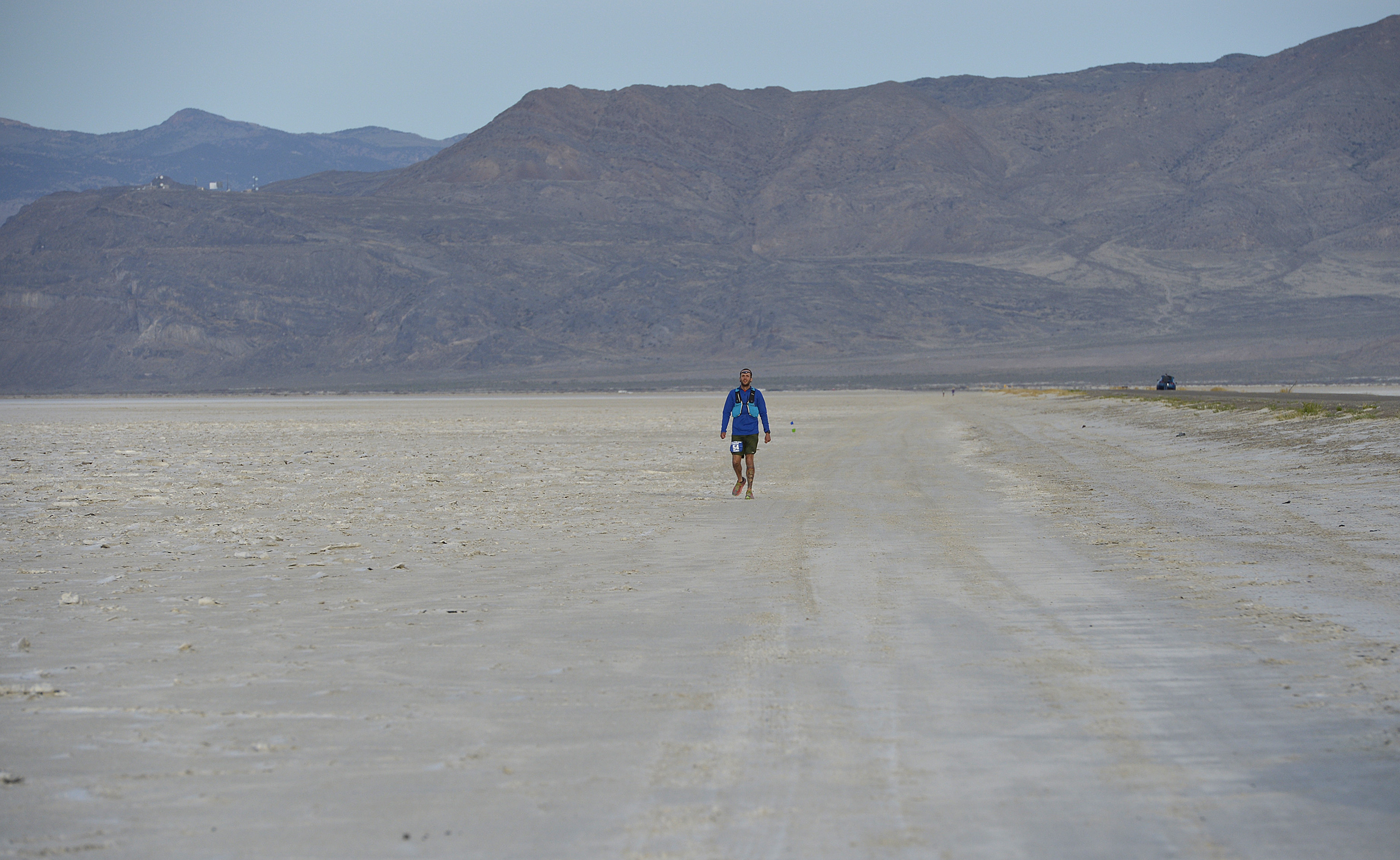 (Scott Sommerdorf | The Salt Lake Tribune) Alex Doolan walks the last mile of the Salt Flats 100 Endurance Run, Saturday, May 5, 2018. 