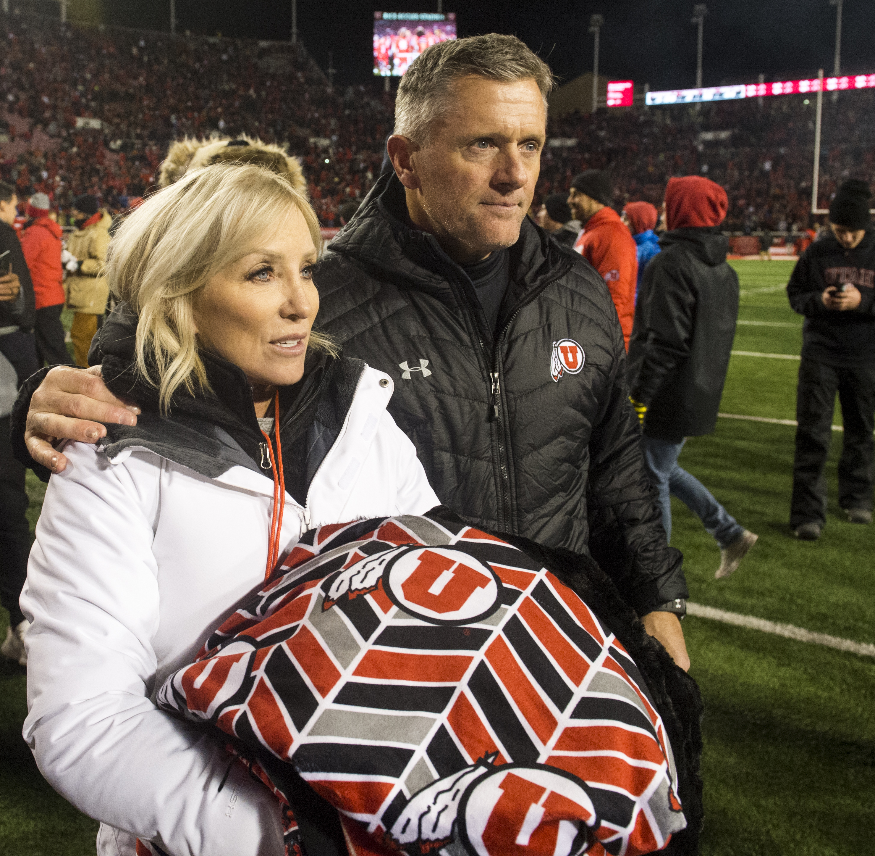 (Rick Egan | The Salt Lake Tribune) Utah Utes head coach Kyle Whittingham leaves the field with his wife Jamie, after Utah defeated BYU for the 8th straight time, in football action between the Brigham Young Cougars and the Utah Utes, at Rice-Eccles Stadium, Saturday, November 24, 2018. 