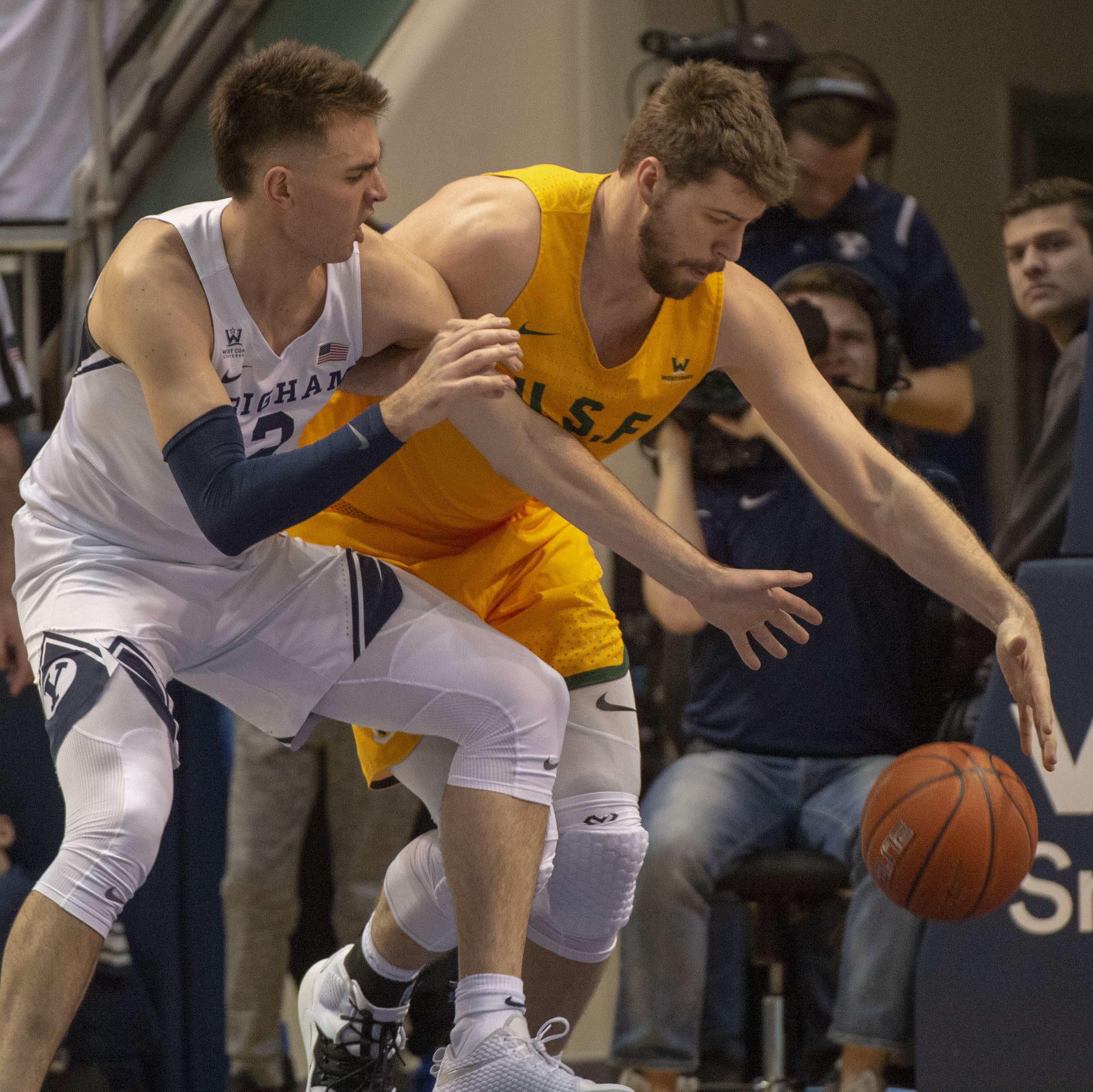 (Rick Egan | The Salt Lake Tribune) Brigham Young Cougars guard Zac Seljaas (2) goes after a loose ball along with San Francisco Dons center Jimbo Lull (5), in WCC basketball action between Brigham Young Cougars and San Francisco Dons, at the Marriott Center, Thursday, February 21, 2018. 