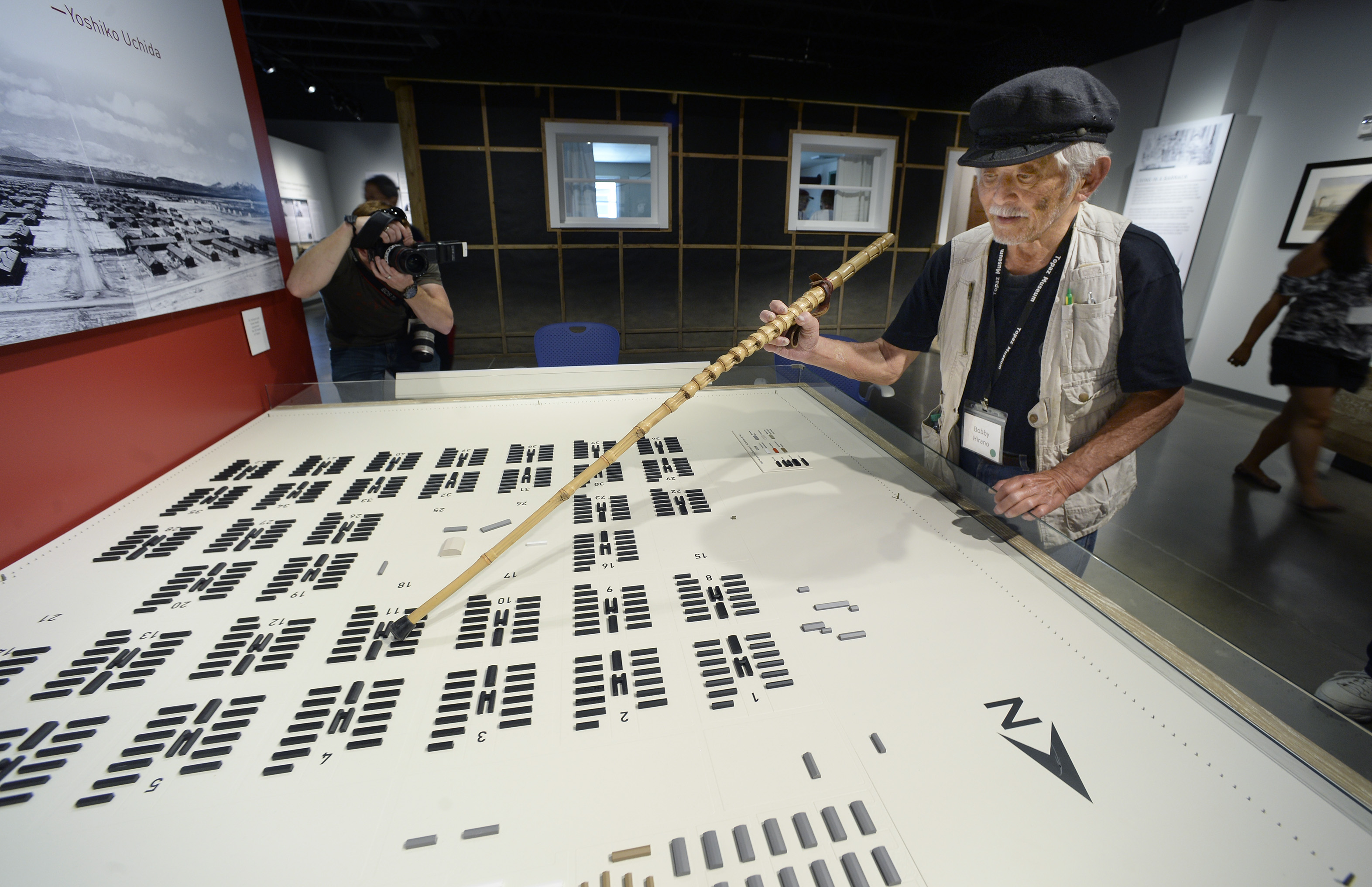 (Scott Sommerdorf | The Salt Lake Tribune) 83-year-old Bobby Hirano, who lived in the Topaz Internment Camp as a 10-year-old boy, uses his cane to point at the barrack in Block 11 during the grand opening of the Topaz Museum in Delta, Saturday, July 8, 2017.