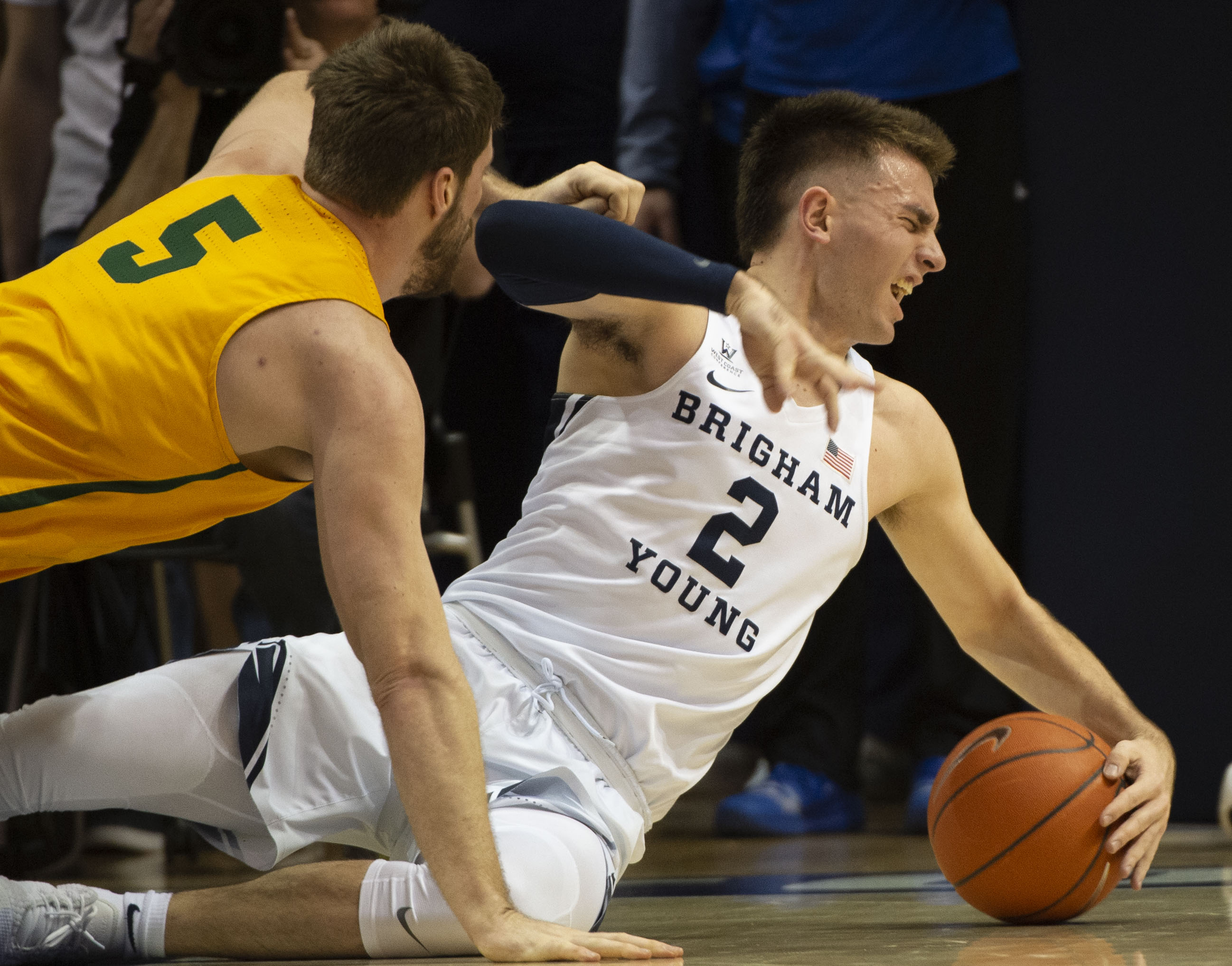 (Rick Egan | The Salt Lake Tribune) San Francisco Dons center Jimbo Lull (5) goes for a loose ball along with Brigham Young Cougars guard Zac Seljaas (2), in WCC basketball action at the Marriott Center, Thursday, February 21, 2018. 