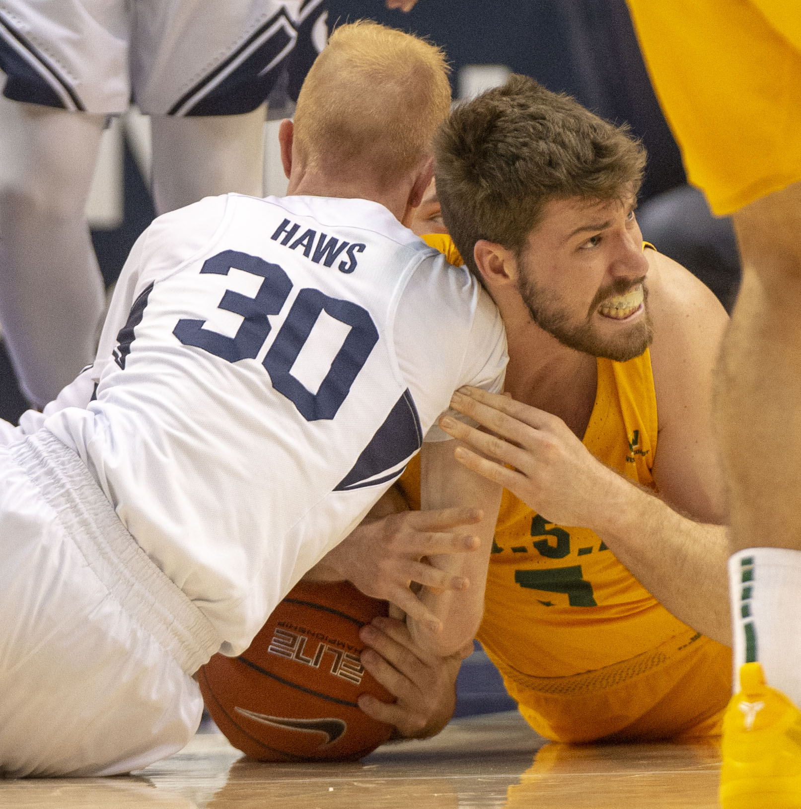 (Rick Egan | The Salt Lake Tribune) Brigham Young Cougars guard TJ Haws (30) goes for a loose ball along with San Francisco Dons center Jimbo Lull (5), in WCC basketball action at the Marriott Center, Thursday, February 21, 2018. 