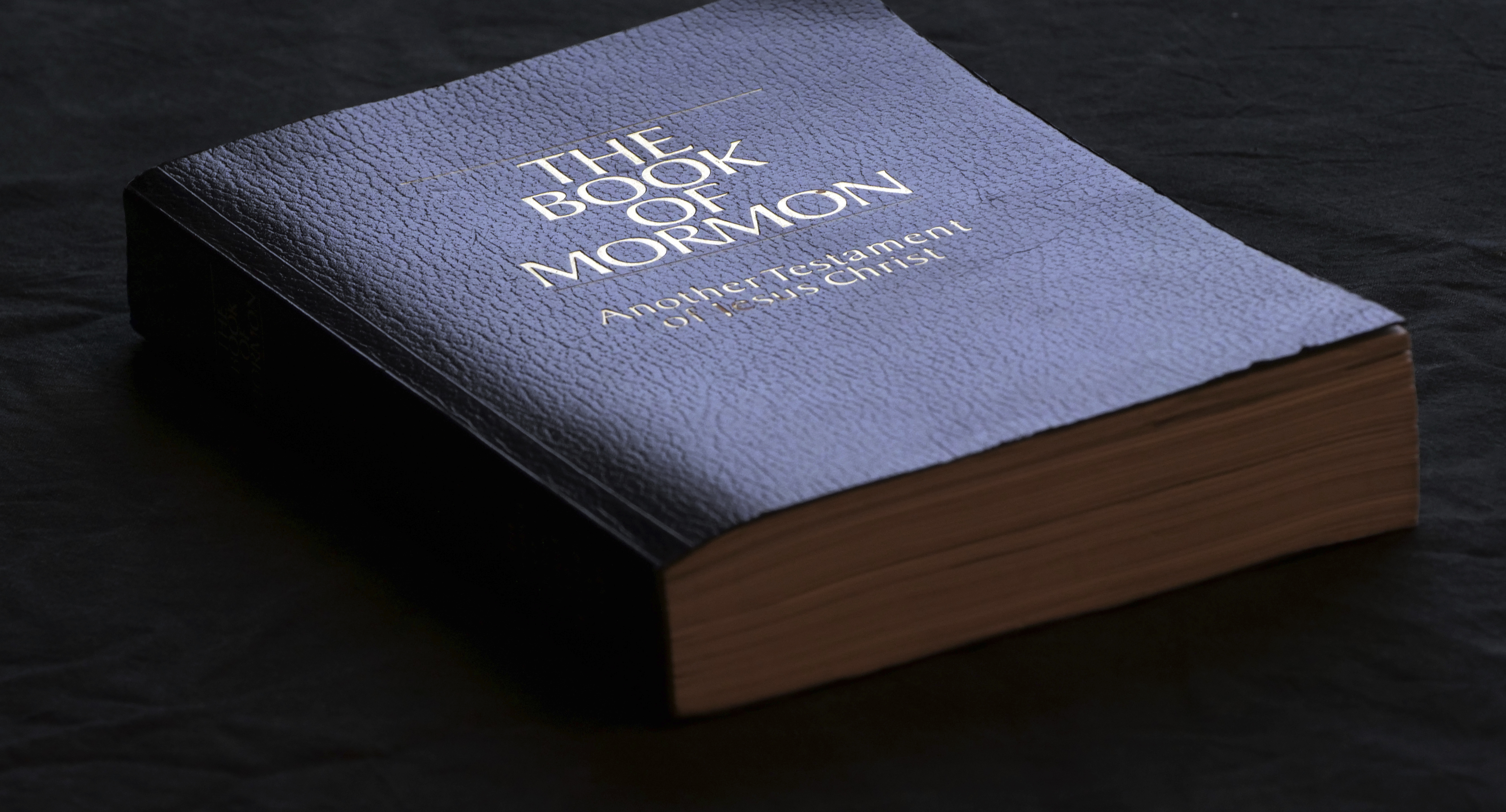 (AP Photo/Rick Bowmer) The Book of Mormon is shown Tuesday, Aug. 21, 2018, Salt Lake City. Sheraton, Westin and other Starwood hotels are finding their religion. Marriott International, which bought Starwood two years ago, has begun putting copies of the Bible and the Book of Mormon in Sheratons, Westins and other hotels in the Starwood family. 