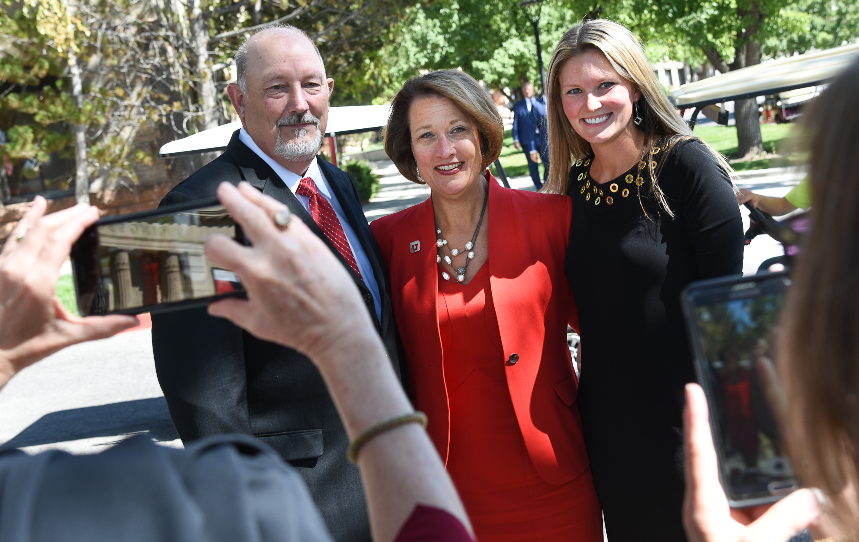 (Francisco Kjolseth | The Salt Lake Tribune) Ruth Watkins, center, poses for friends photographs with her husband and daughter Bob and Kimberly Young, before being inaugurated as the University of Utah's 16th president, and first female, at Kingsbury Hall on Friday, Sept. 21, 2018.