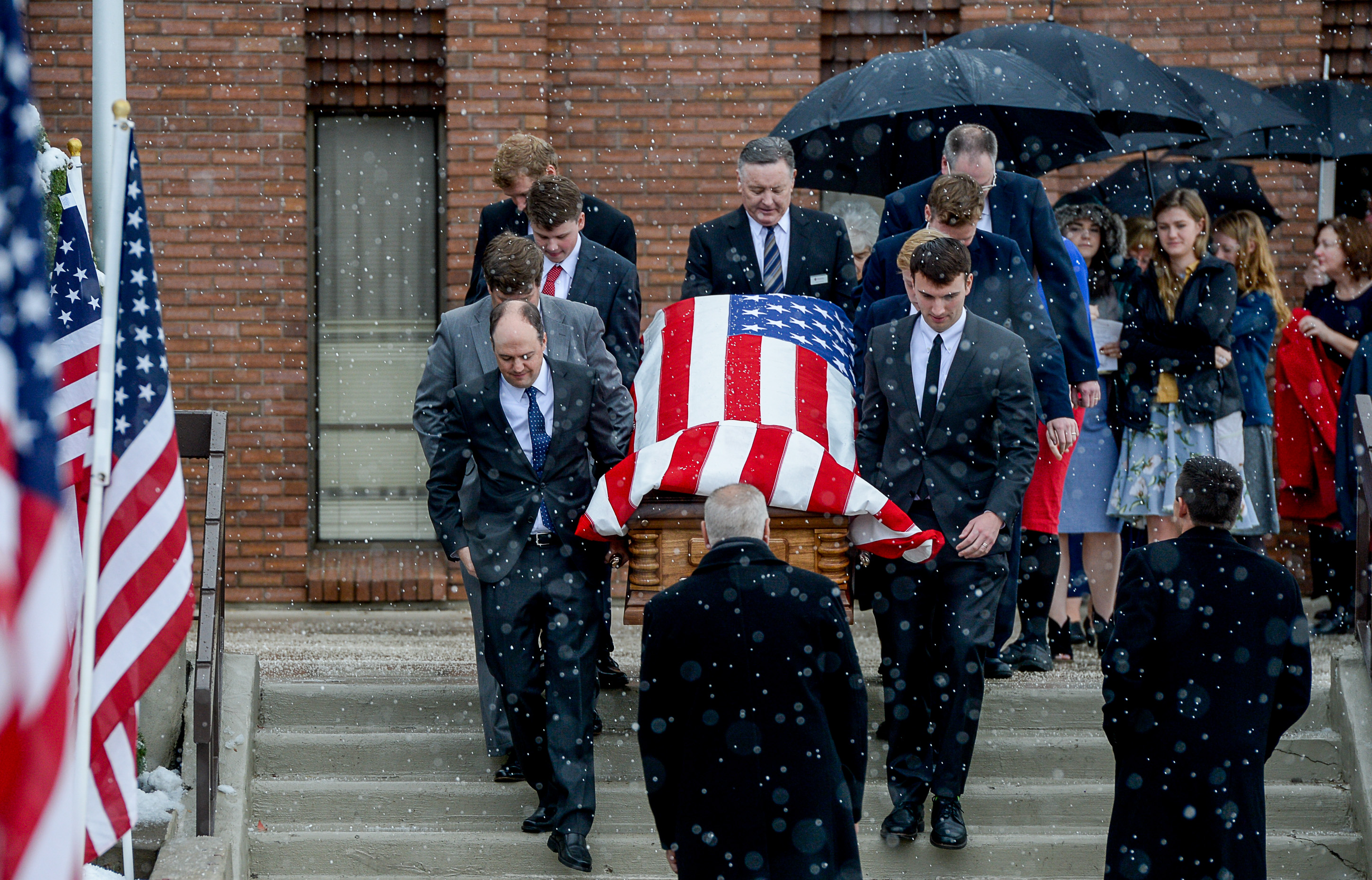 (Francisco Kjolseth | The Salt Lake Tribune) Pallbearers carry the casket of former congressman Jim Hansen to be interred at Farmington City Cemetery on Saturday, Nov. 24, 2018. 