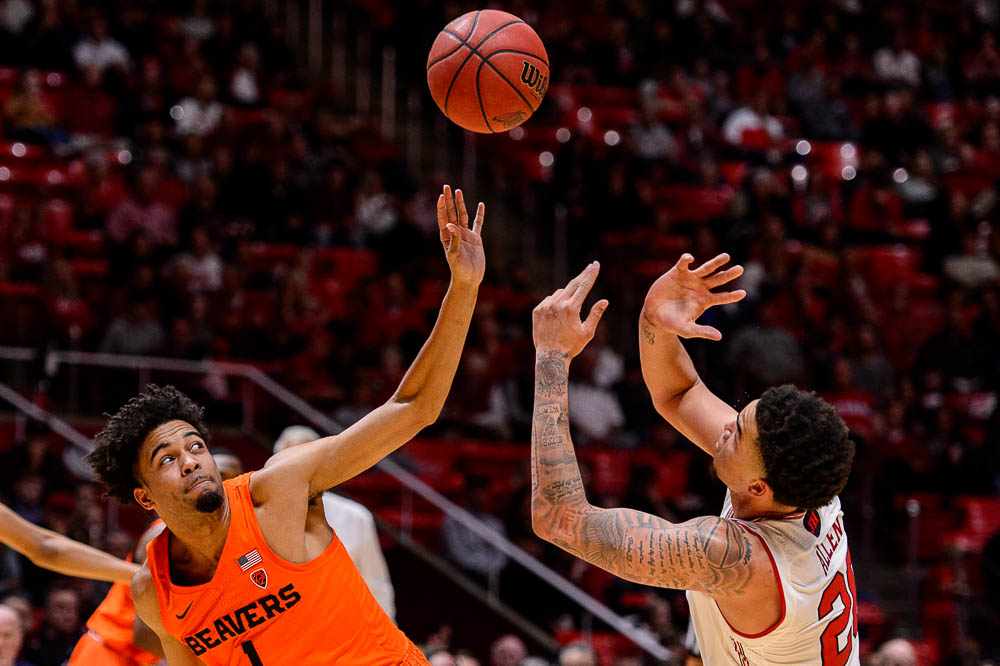 (Trent Nelson | The Salt Lake Tribune) Oregon State Beavers guard Stephen Thompson Jr. (1) and Utah Utes forward Timmy Allen (20) as Utah hosts Oregon State, NCAA basketball in Salt Lake City on Saturday Feb. 2, 2019.