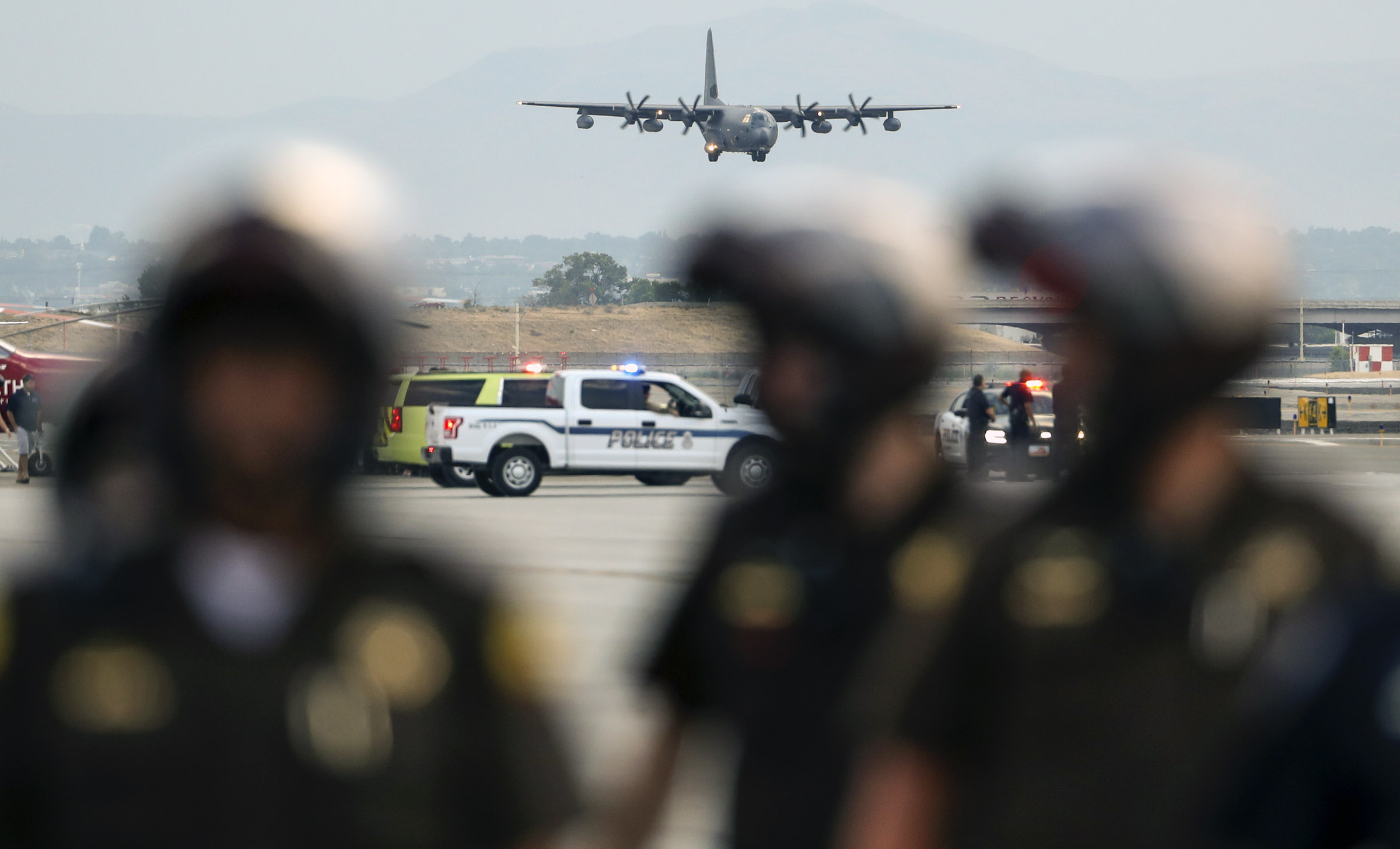 (Steve Griffin | Deseret News, pool photo) A C130-J carrying the casket of Draper Battalion Chief Matt Burchett prepares to landa at the Utah Air National Guard Base in Salt Lake City on Wednesday, Aug. 15, 2018. Burchett was killed while fighting the Mendocino Complex Fire north of San Francisco.
