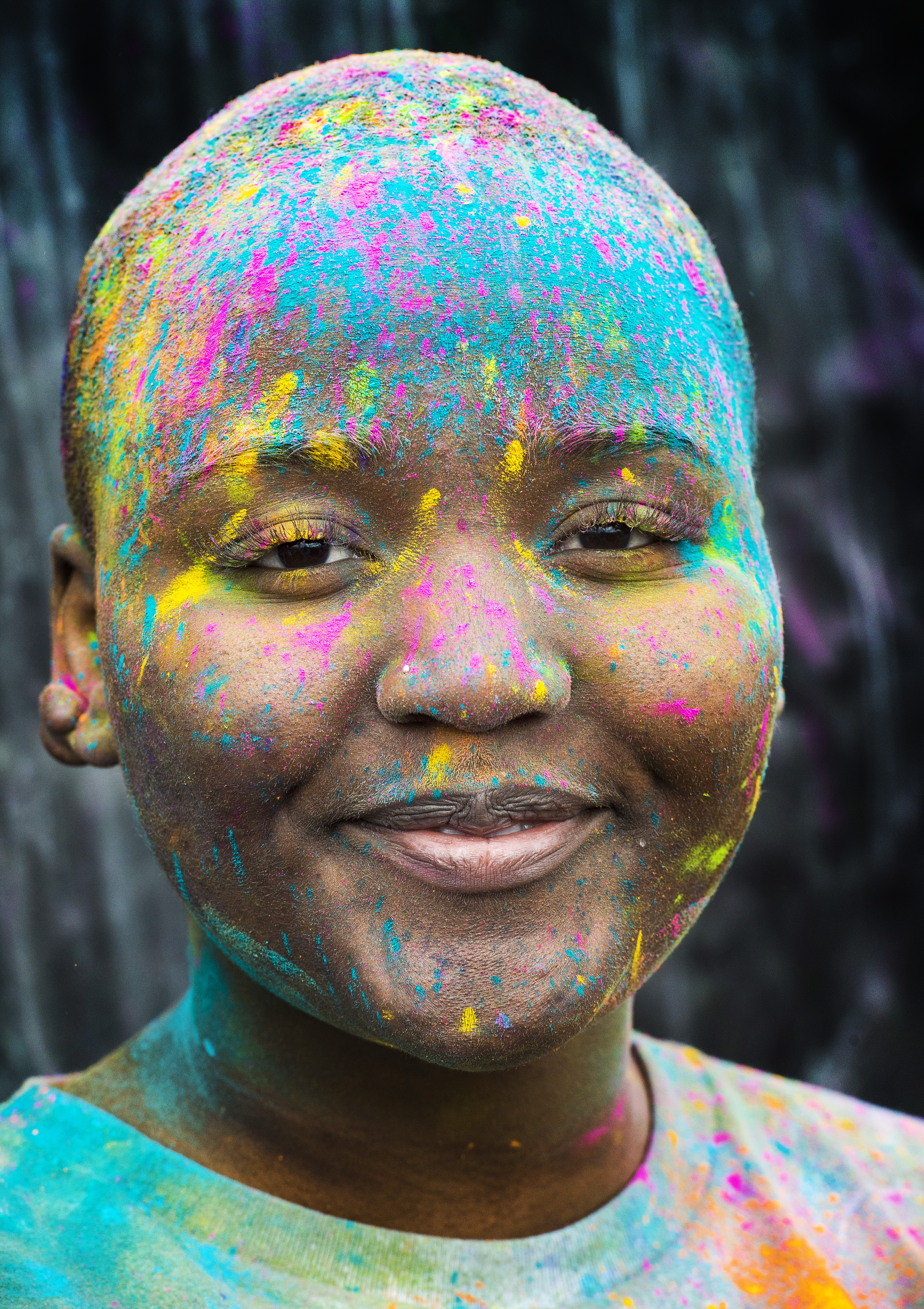 (Rick Egan | The Salt Lake Tribune) Vainia, takes a break from the crowd, at the Holi Festival of Colors celebration at the Sri Sri Radha Krishna Temple in Spanish Fork, Saturday, March 30, 2019. 