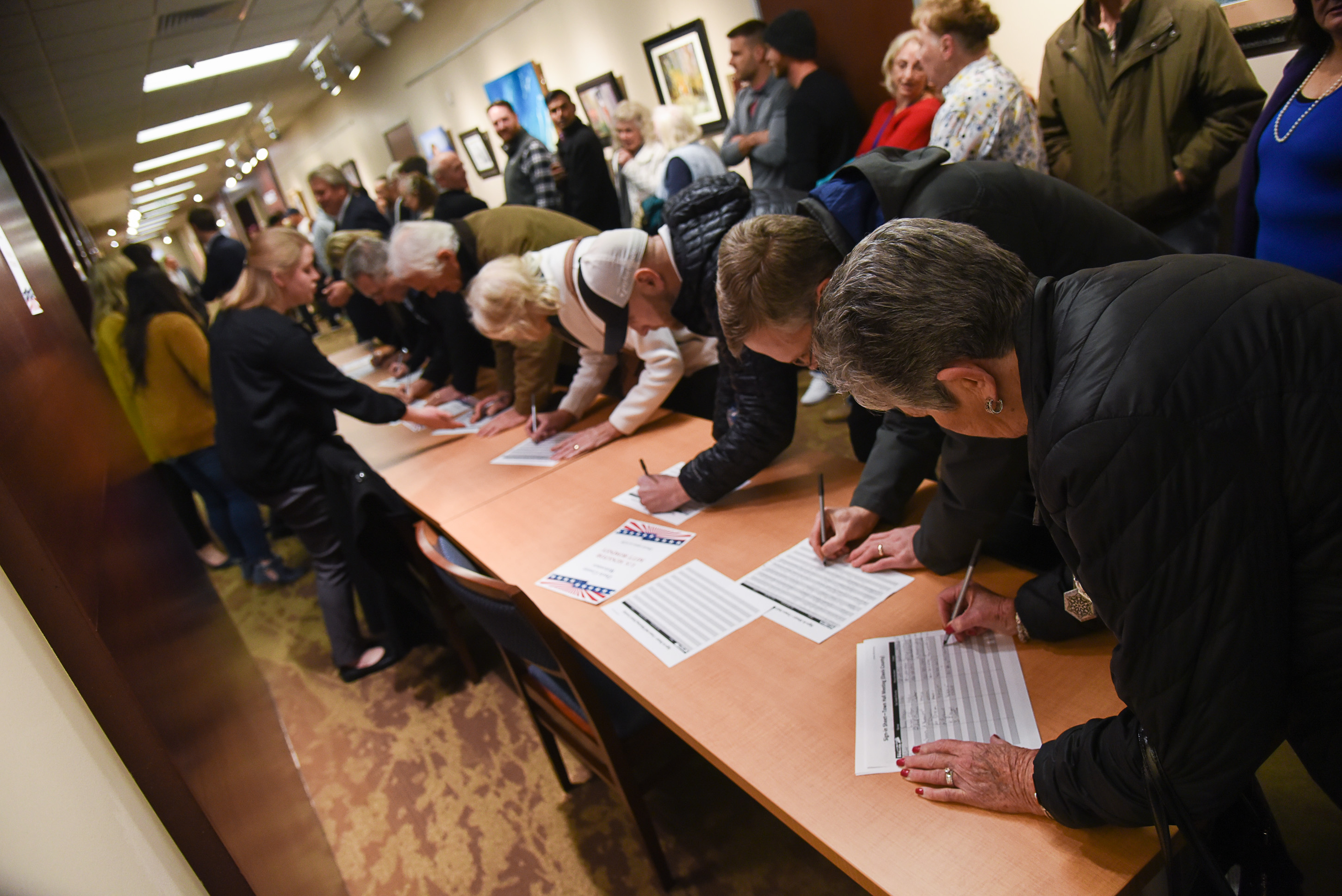 (Francisco Kjolseth | The Salt Lake Tribune) People sign in as U.S. Senator Mitt Romney gets ready to hold a town hall meeting at the Davis County administration building, Tuesday, January 22, 2019, to hear from local residents.