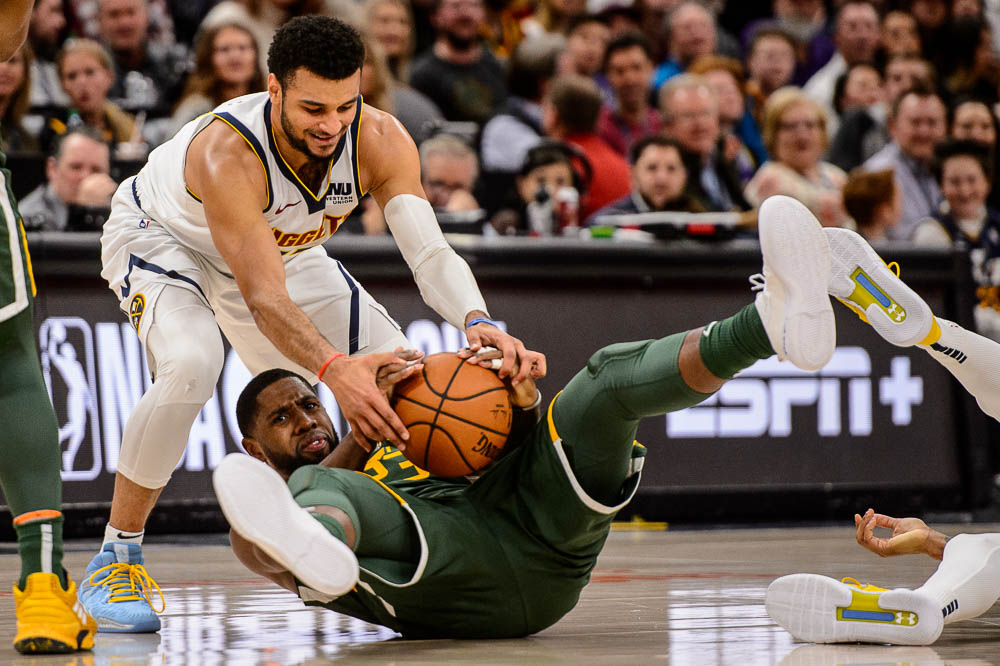 (Trent Nelson | The Salt Lake Tribune) Denver Nuggets guard Jamal Murray (27) and Utah Jazz forward Royce O'Neale (23) as the Utah Jazz host the Denver Nuggets, NBA basketball in Salt Lake City on Wednesday Jan. 23, 2019.