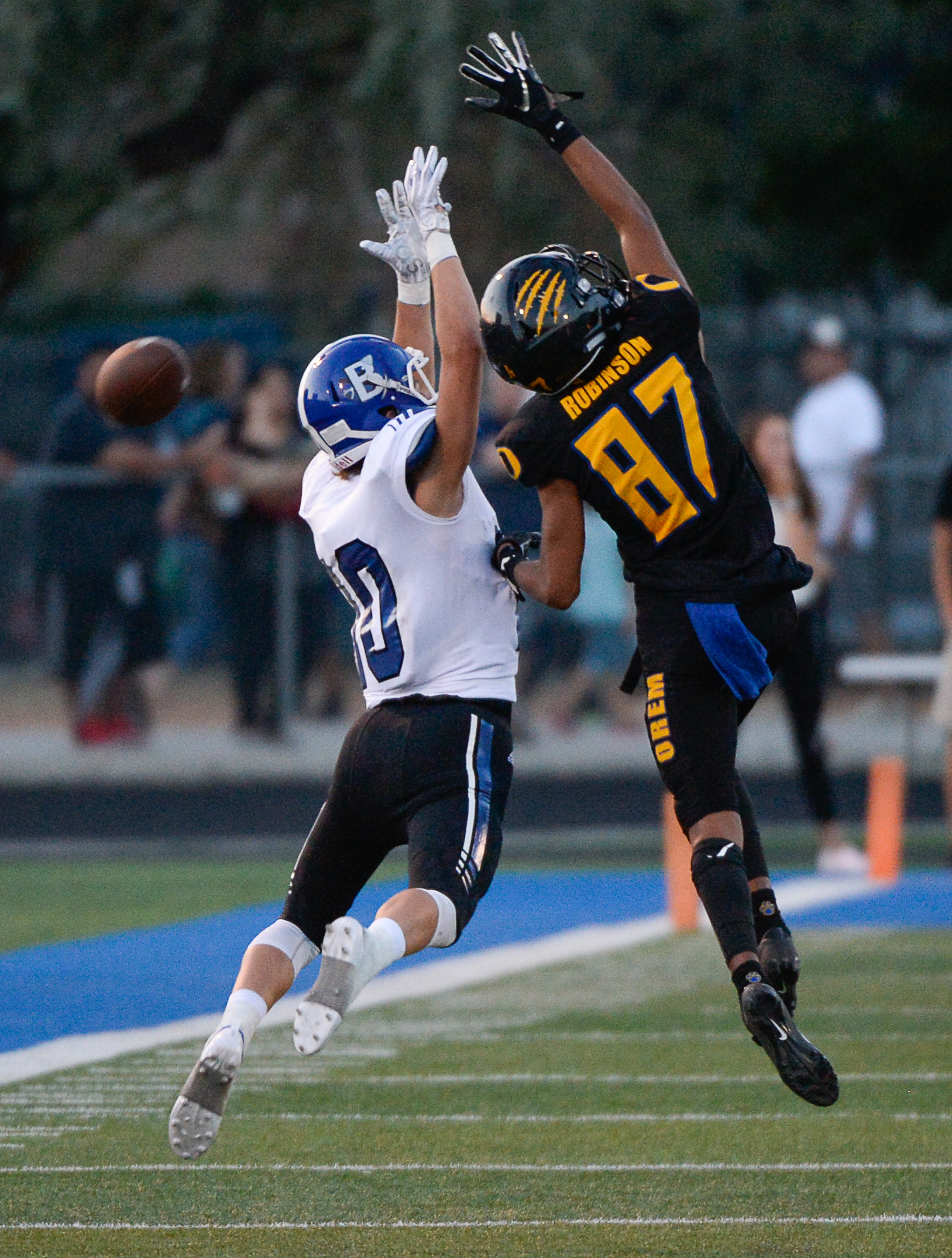 (Francisco Kjolseth | The Salt Lake Tribune) Bingham's Luke Wilson is blocked by Orem's Jakob Robinson on a long pass attempt, Thursday, Aug. 16, 2018 in Orem.