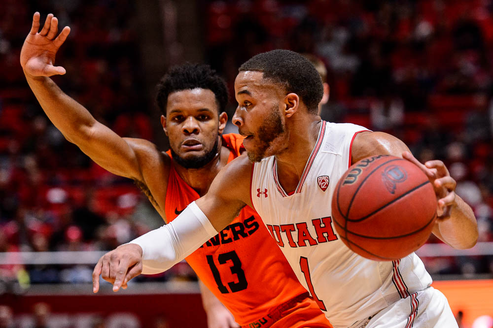 (Trent Nelson | The Salt Lake Tribune) Utah Utes guard Charles Jones Jr (1) drives on Oregon State Beavers guard Antoine Vernon (13) as Utah hosts Oregon State, NCAA basketball in Salt Lake City on Saturday Feb. 2, 2019.