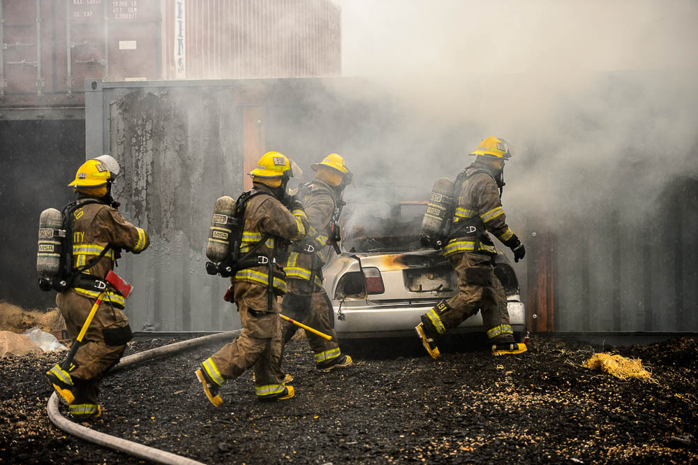 (Trent Nelson | The Salt Lake Tribune) Unified Fire recruits in a live response to a vehicle and structure fire at the Unified Fire Authority Training Center in Magna on Tuesday April 16, 2019.
