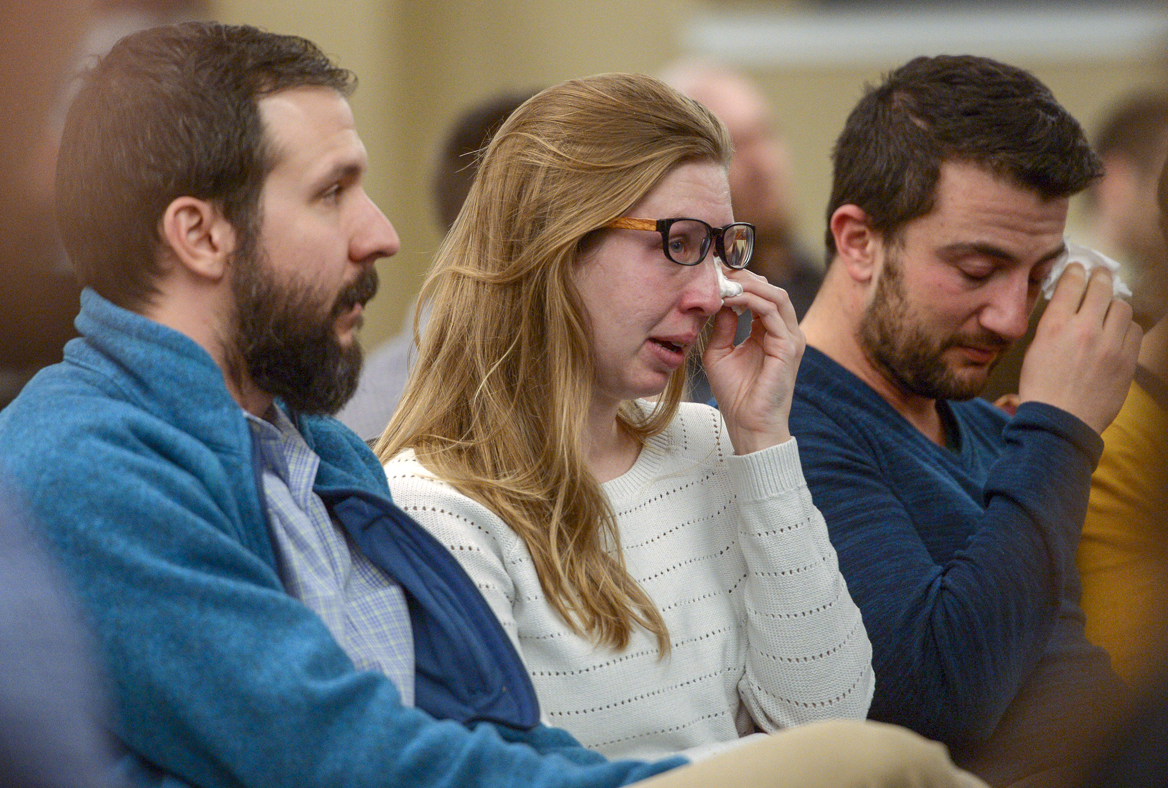 Leah Hogsten | The Salt Lake Tribune l-r Winston Plunkett, wife Lesley Plunkett and Aaron Gale weep as fellow medical interns and faculty recount stories and memories in the honor and memory of Sarah Hawley during the University of Utah's School of Medicine's candlelight vigil, Feb. 4, 2019. On Jan. 27, 2019 Salt Lake City police found 27-year-old physician Sarah Hawley and her boyfriend, Travis Geddes, dead at their Sugar House home. Geddes, 30, shot Hawley before killing himself.