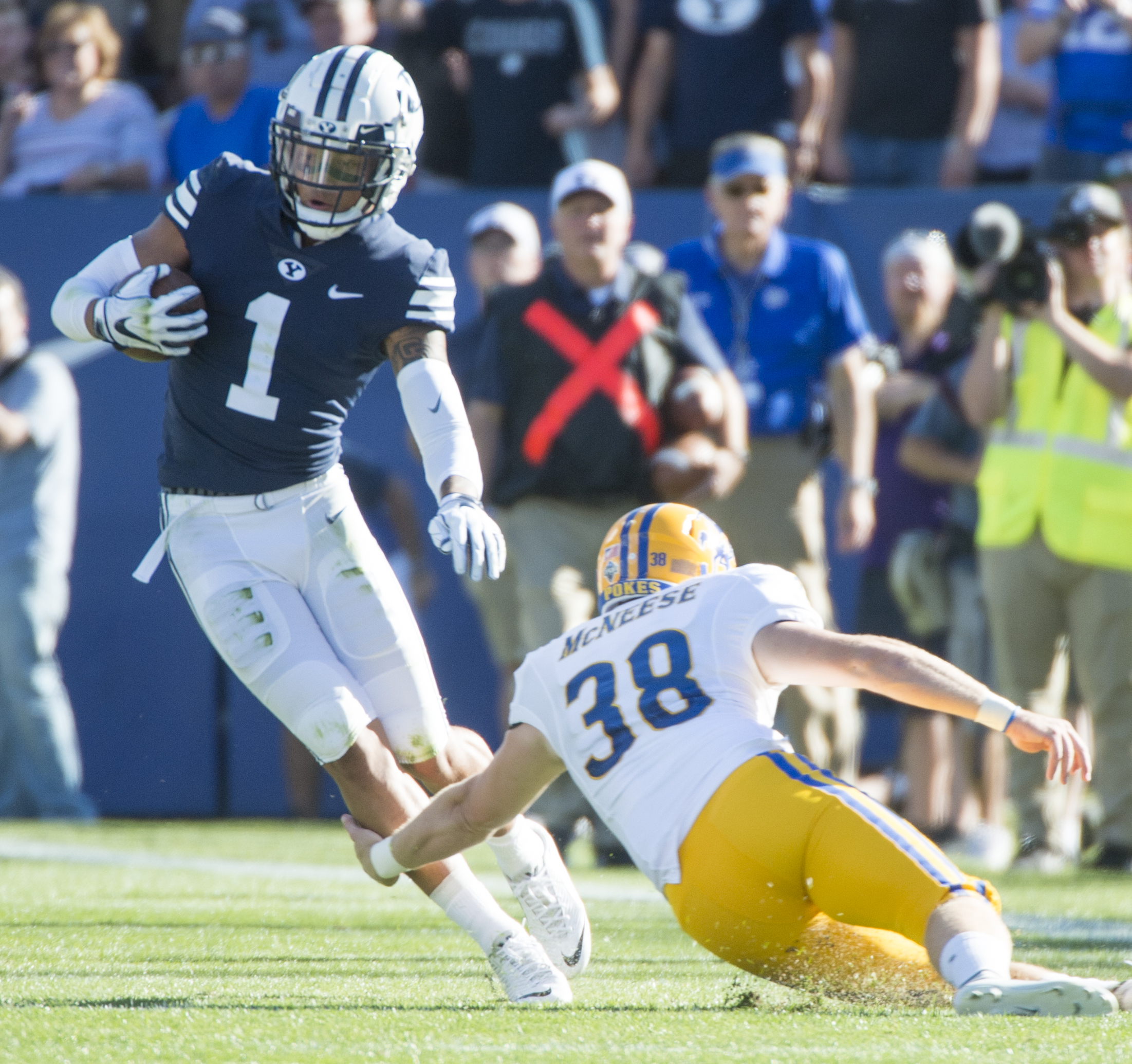 (Rick Egan | The Salt Lake Tribune) Brigham Young Cougars defensive back Troy Warner (1) tries to get past McNeese State Cowboys punter Bailey Raborn (38), after picking up a blocked field goal attempt, in football action Brigham Young Cougars vs McNeese State Cowboys at Lavell Edwards Stadium, Saturday, Sept. 22, 2018. 