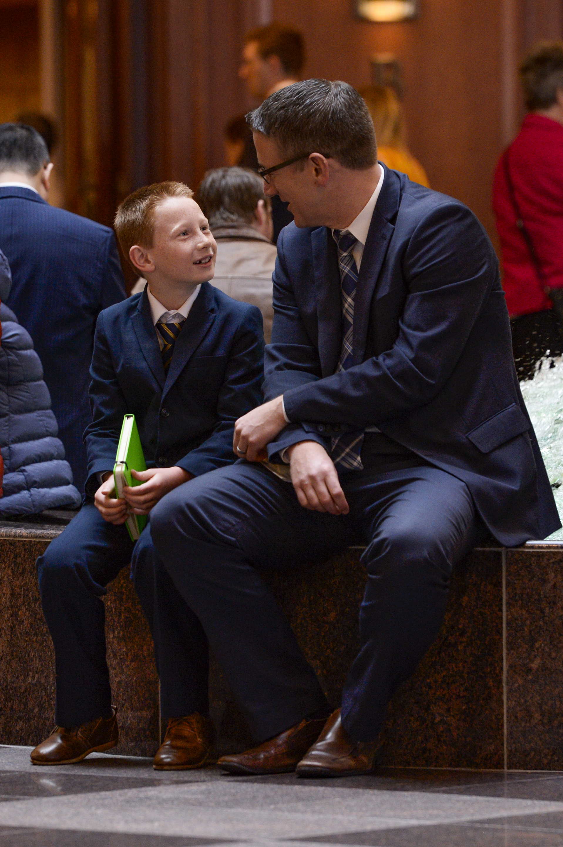 (Leah Hogsten | The Salt Lake Tribune_ l-r Benson Bpwers. 8, from American Fork attends his first General Conference with his father, Brian Bowers, during the morning session of The Church of Jesus Christ of Latter-day Saints 189th Annual General Conference in Salt Lake City.