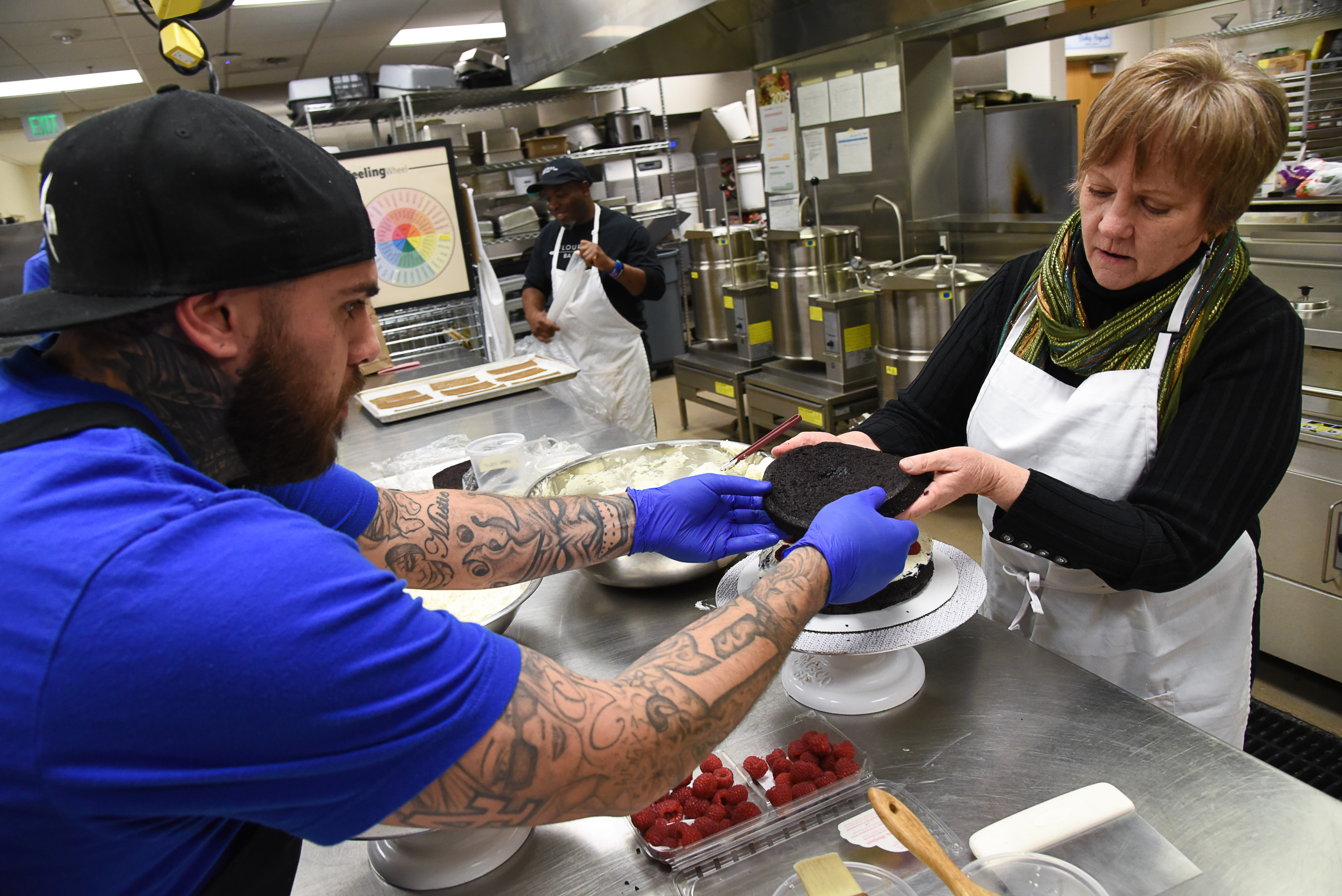 (Francisco Kjolseth | The Salt Lake Tribune) Paid intern chef for Flourish bakery A.J. Collette, helps actress Betsy West prepares for the upcoming role of a Southern Baptist bakery owner in North Carolina faced with a request to bake a cake for a gay couple getting married for Salt Lake Acting Company's production of "The Cake." A self admitted baking novice, West, in search of better authenticity in portraying her role received a one-on-one lesson from the chef's.