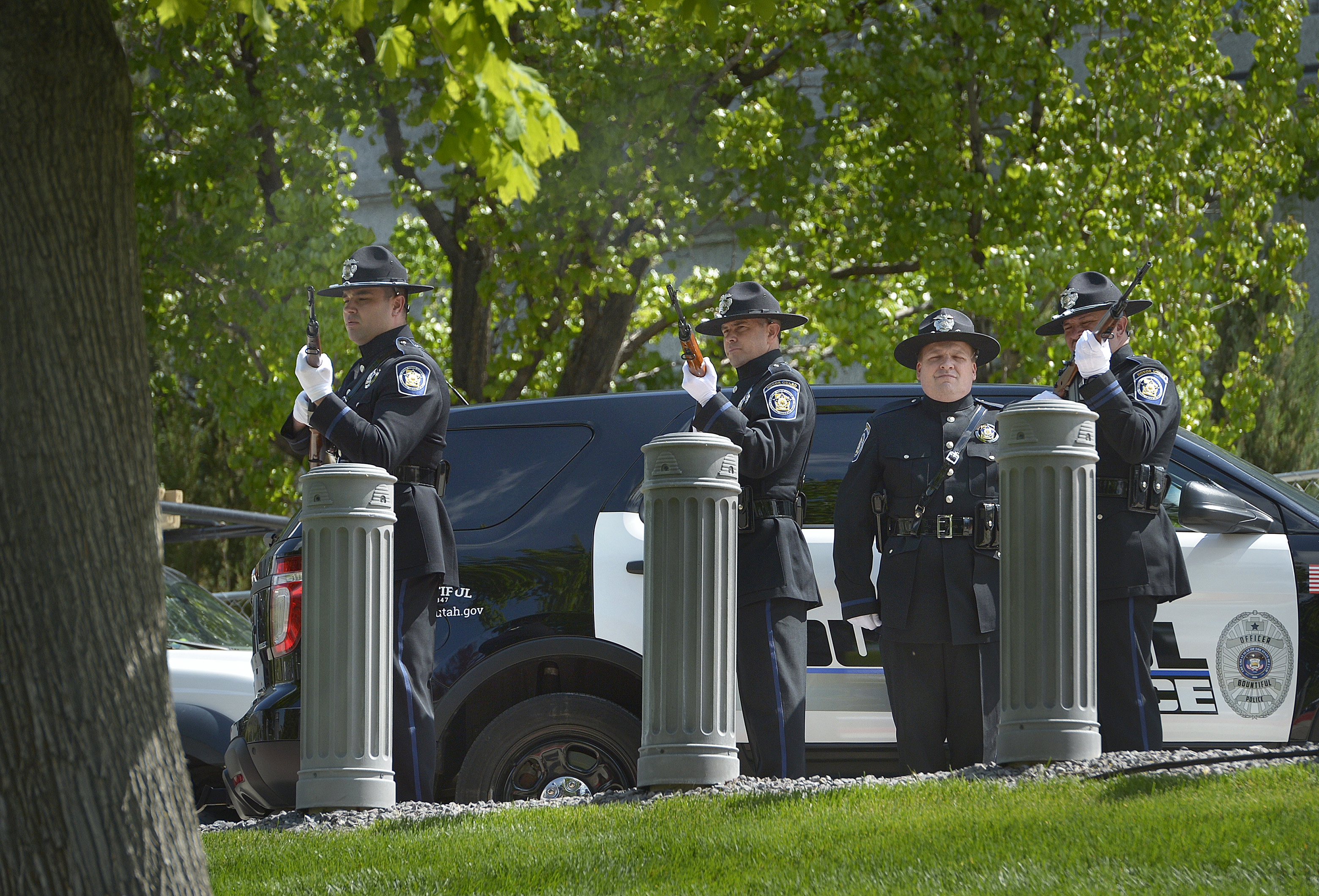 (Scott Sommerdorf | The Salt Lake Tribune) The Utah Fraternal Ortder of Police Honor Guard fires the 21 gun salute during the Utah Law Enforcement Memorial to honor the 142 police officers killed in the line of duty during the state's history, Thursday, May 3, 2018. No Utah law enforcement officer died in the line of duty last year.