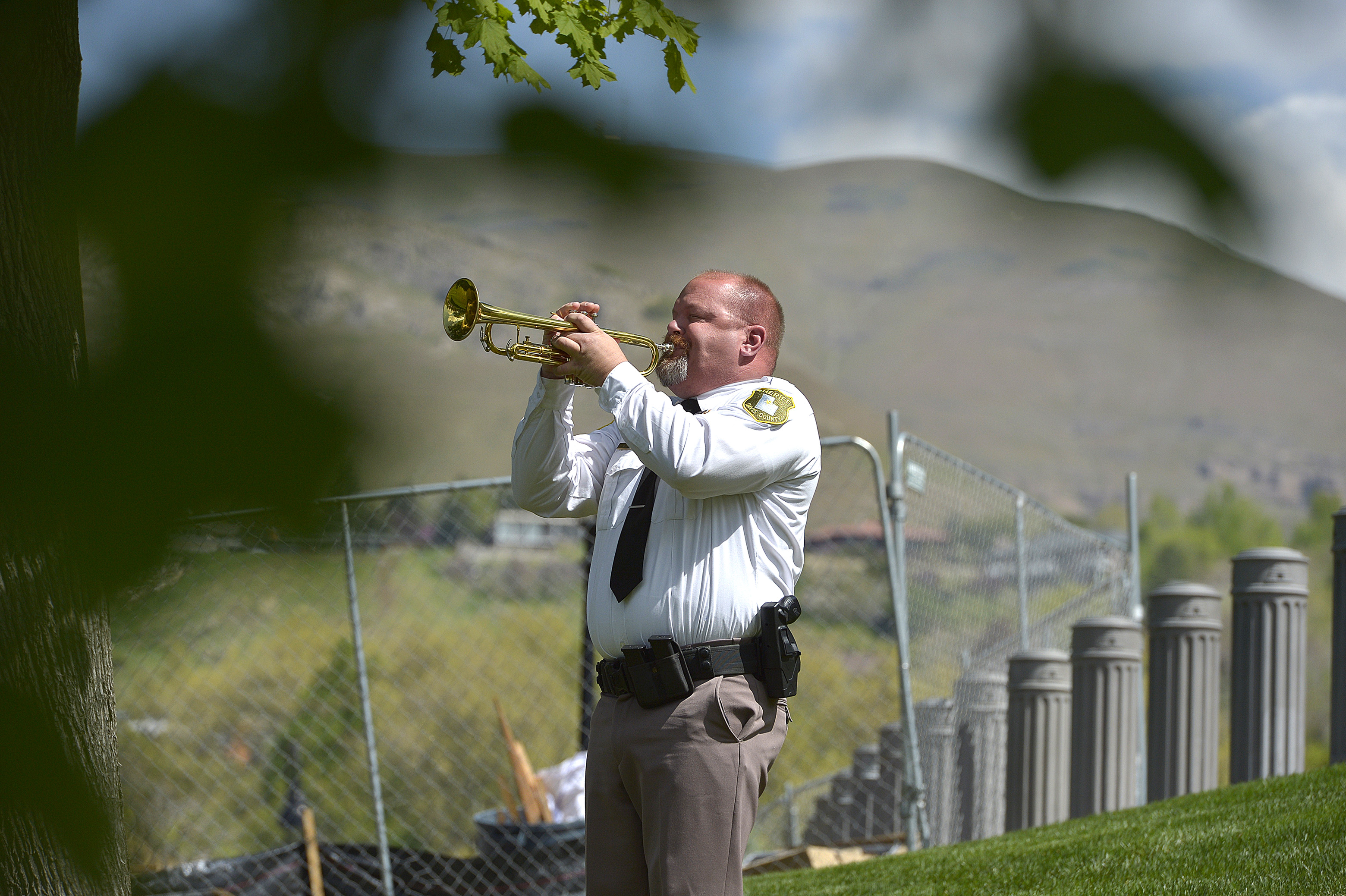 (Scott Sommerdorf | The Salt Lake Tribune) Deputy Logan Payne sounds Taps during the Utah Law Enforcement Memorial honoring the 142 police officers killed in the line of duty during the state's history, Thursday, May 3, 2018. No Utah law enforcement officer died in the line of duty last year.