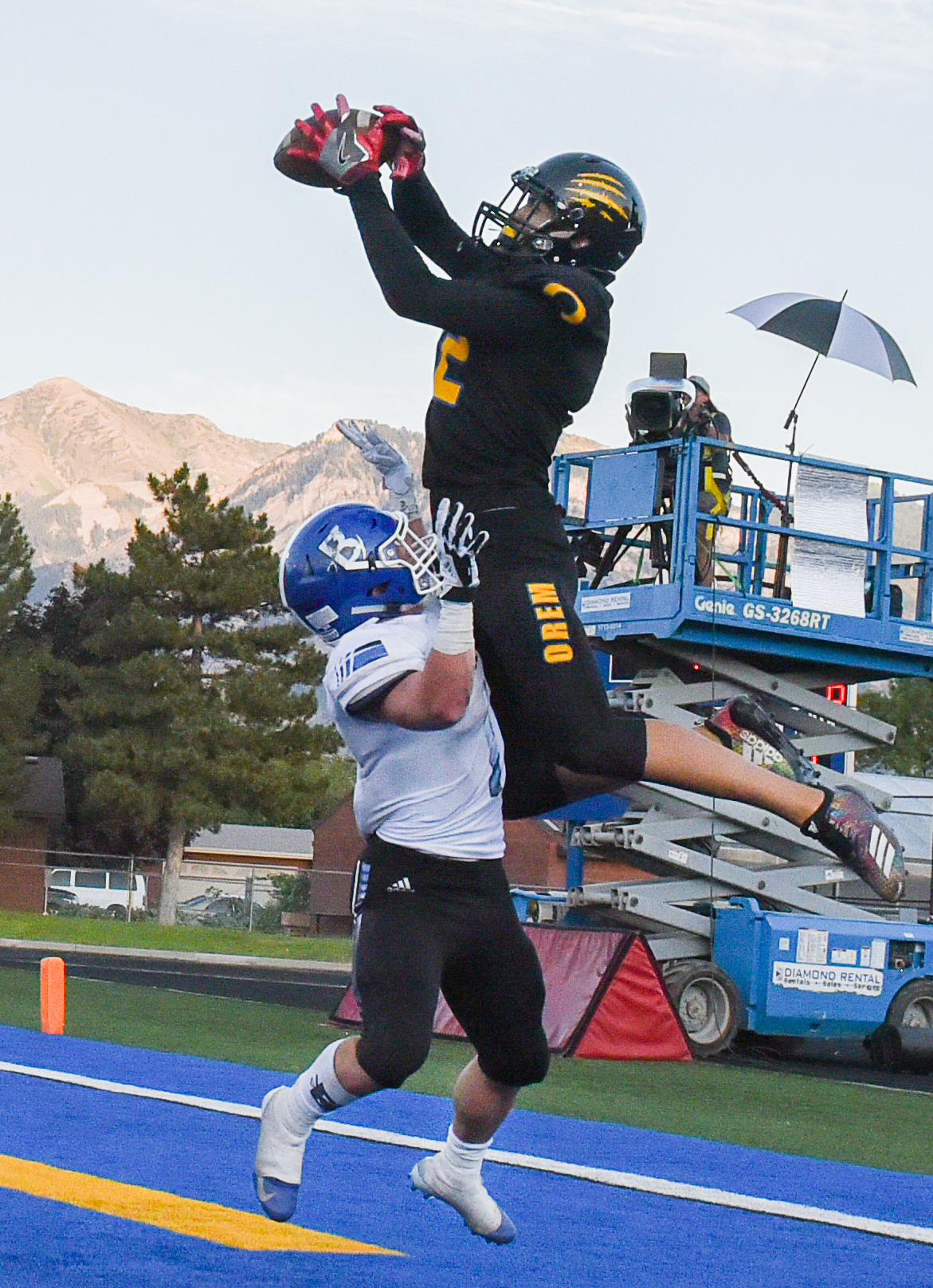 (Francisco Kjolseth | The Salt Lake Tribune) Orem's Puka Nacua pulls in a touchdown pass over Braedon Wissler of Bingham in the first half of the game in Orem, Thursday, Aug. 16, 2018.