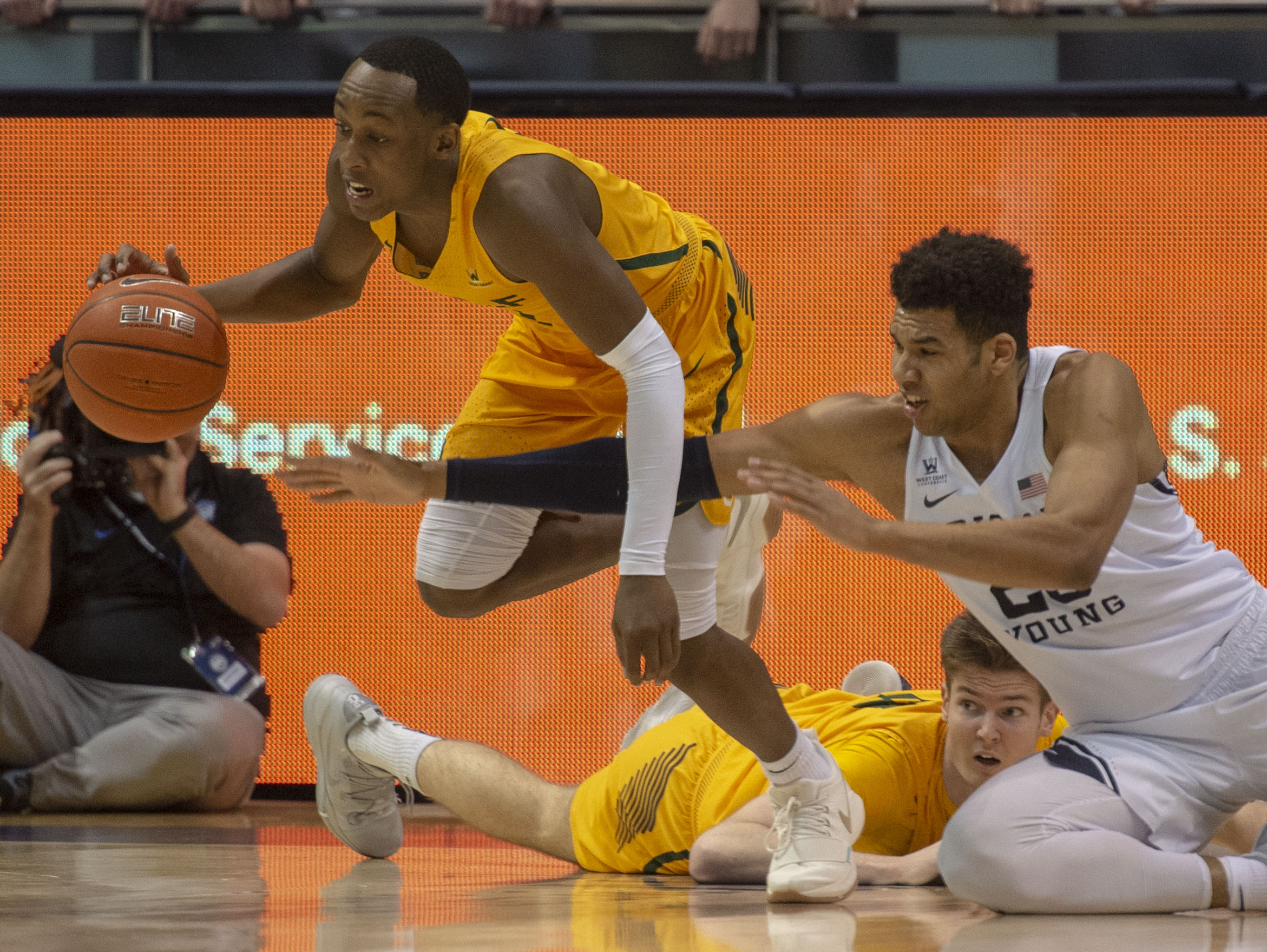 (Rick Egan | The Salt Lake Tribune) Brigham Young Cougars forward Yoeli Childs (23) goes for a loose ball along with San Francisco Dons guard Jamaree Bouyea (1), in WCC basketball action at the Marriott Center, Thursday, February 21, 2018. 
