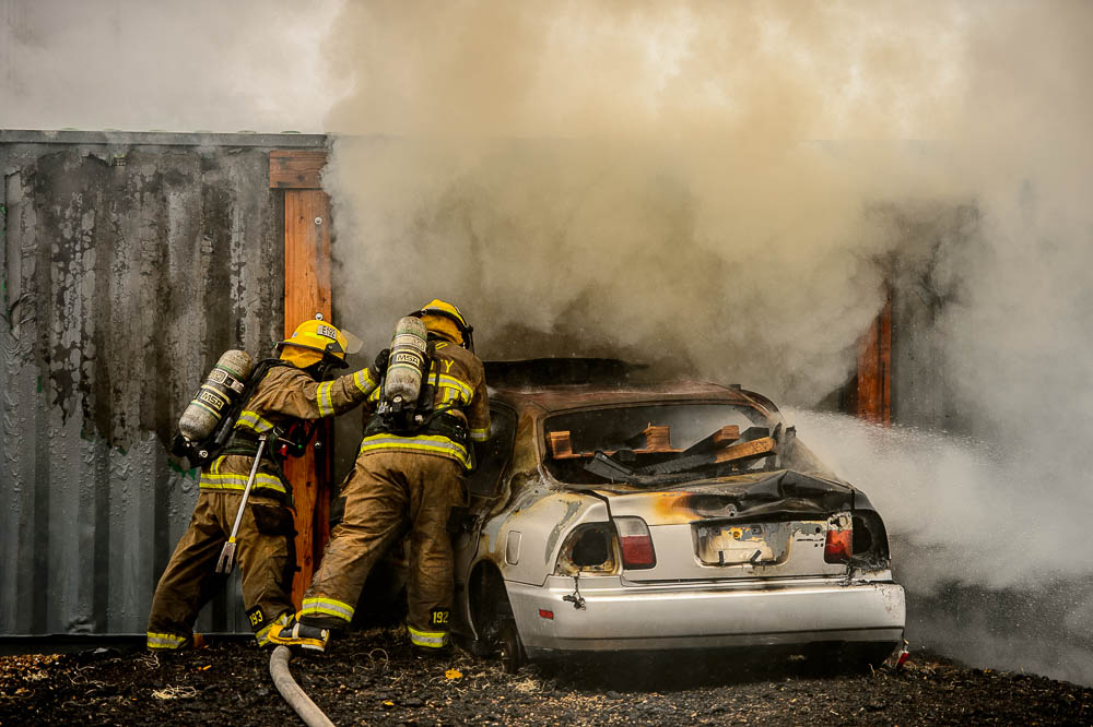 (Trent Nelson | The Salt Lake Tribune) Unified Fire recruits in a live response to a vehicle and structure fire at the Unified Fire Authority Training Center in Magna on Tuesday April 16, 2019.