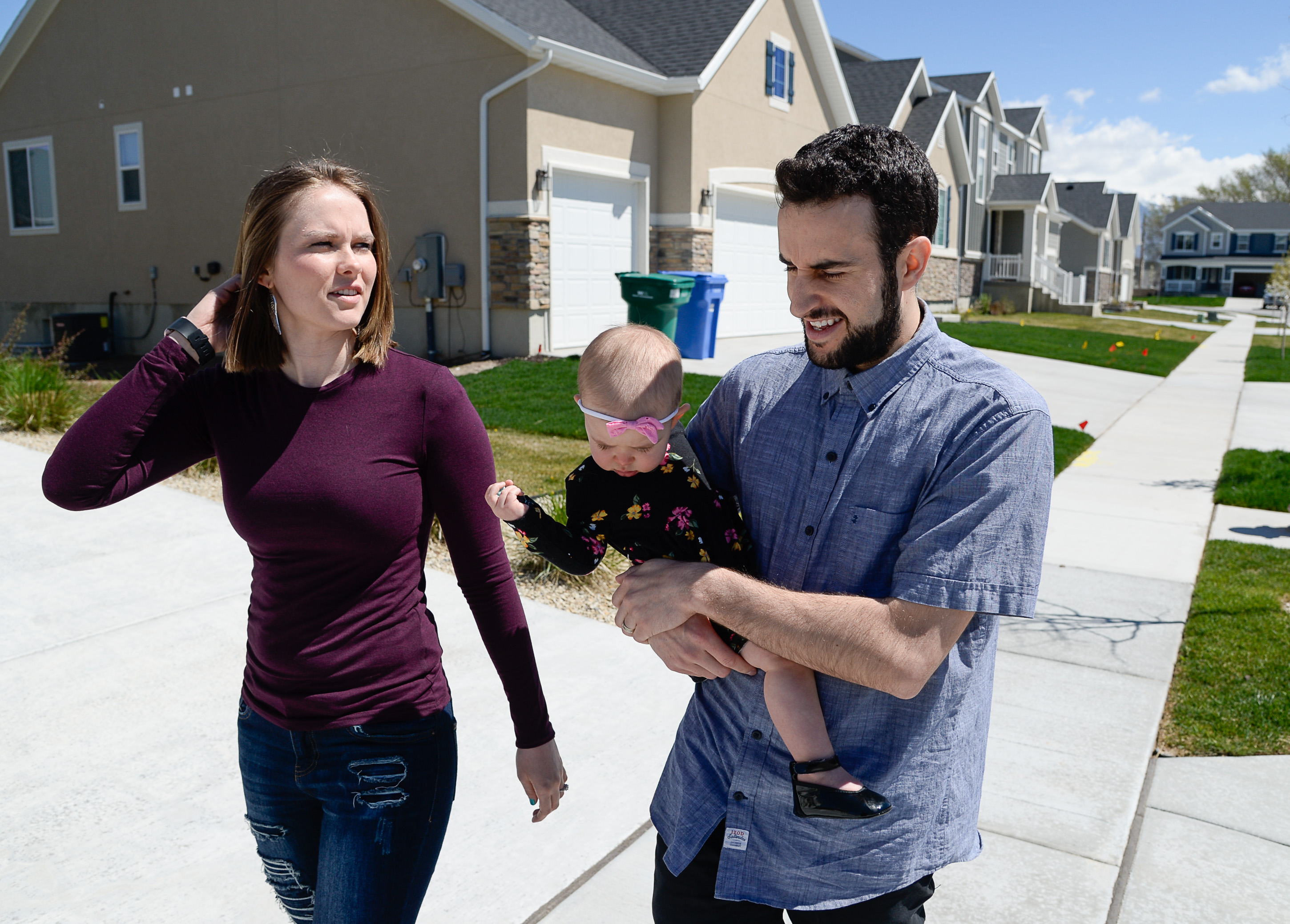 (Francisco Kjolseth | The Salt Lake Tribune) Ember and Jeremy Ulrich take their daughter Jemma, 1, for a walk around their newly developed neighborhood in Lehi after moving there from Pleasant Grove last October. Along with some friends who were also looking to get more house for their money and ended up moving in next door, Jeremy wanted to be closer to his job at Adobe in Lehi.