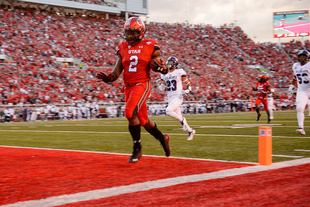 (Trent Nelson | The Salt Lake Tribune) Utah Utes running back Zack Moss (2) scores a touchdown as the University of Utah Utes host the Weber State Wildcats, Thursday Aug. 30, 2018 at Rice-Eccles Stadium in Salt Lake City.