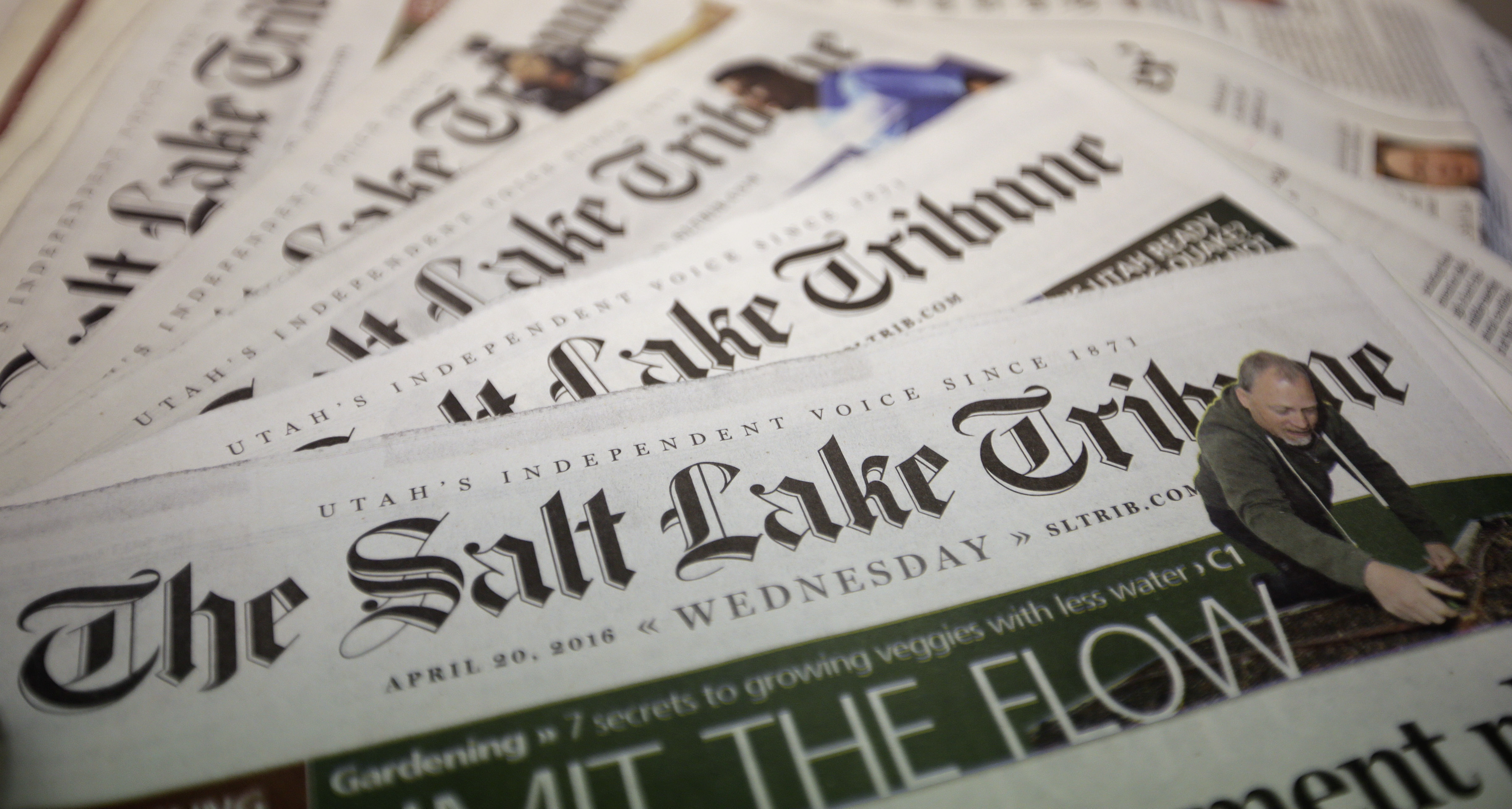 FILE - This April 20, 2016, file photo shows copies of The Salt Lake Tribune newspaper in Salt Lake City. (AP Photo/Rick Bowmer, File)
