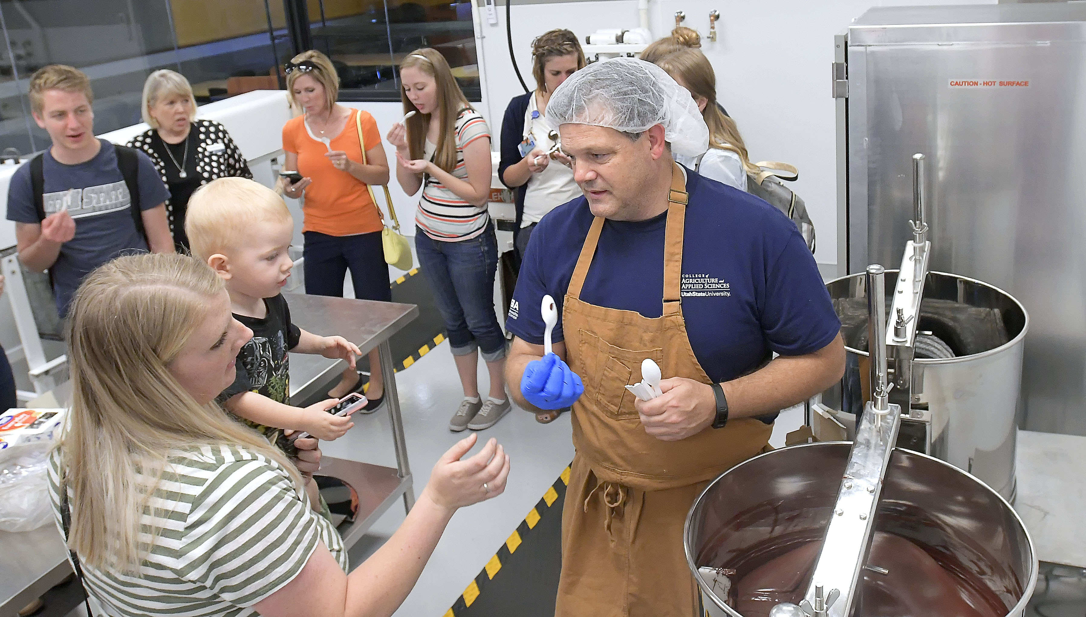 (Eli Lucero | The Herald Journal) Steve Shelton hands out samples during a public tour of the Aggie Chocolate Factory on Tuesday in Logan.