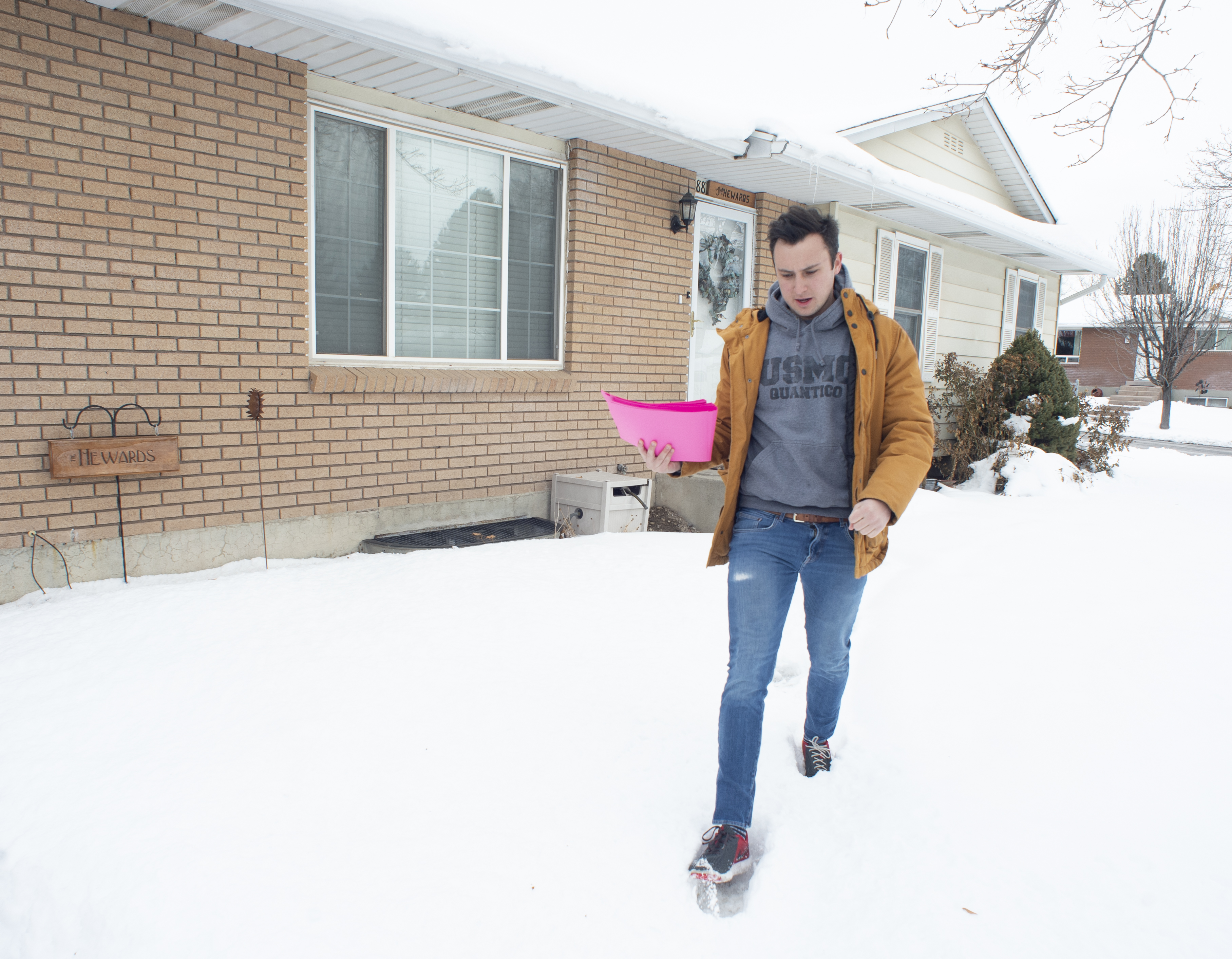 (Rick Egan | The Salt Lake Tribune) Keaton Hill goes door to door in a neighborhood in Taylorsville with other supporters of the fuller Medicaid expansion, urging residents to call their senator, Saturday, Feb. 9, 2019. 