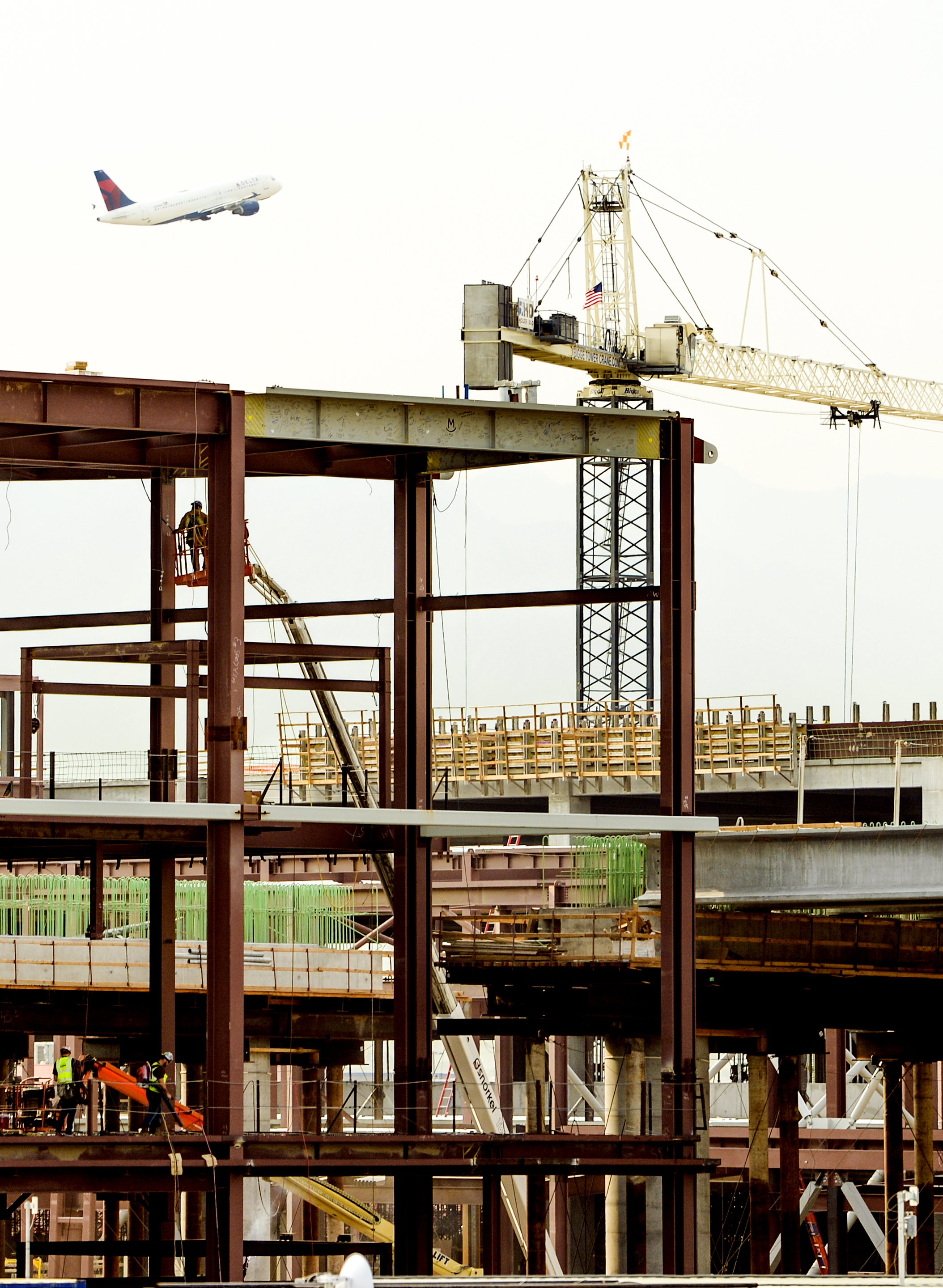 Leah Hogsten | The Salt Lake Tribune Salt Lake City International Airport's first phase construction of the $3.6 billion project is hitting the halfway mark Ñ and large new buildings and elevated roadways are more easily seen. Nearing completion is the new concourse for aircraft gates, an enclosed new terminal, the steel skeleton of a new ÒgatewayÓ building, a new five-story parking garage and elevated roadways. 
