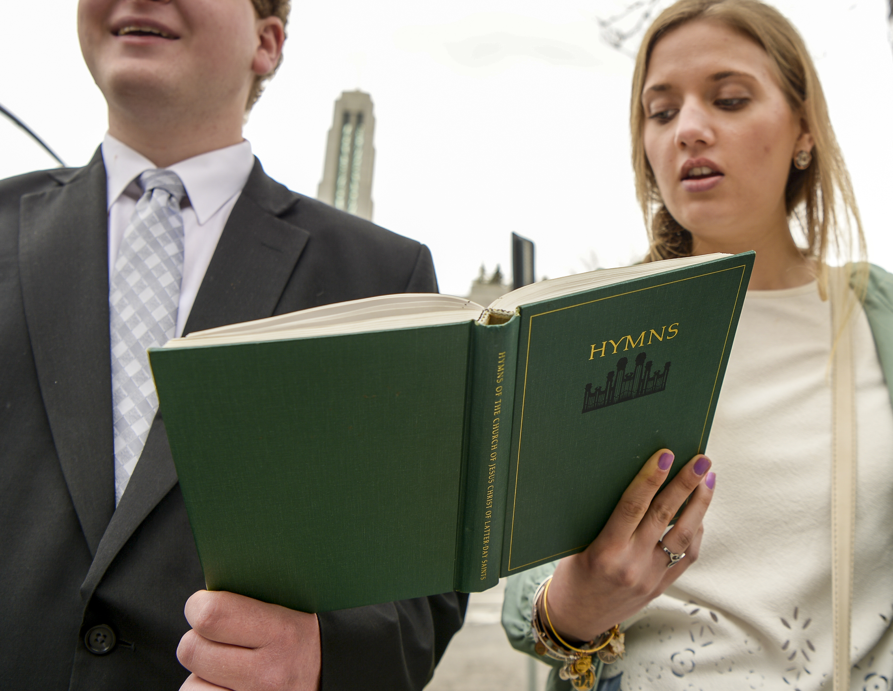 Leah Hogsten | The Salt Lake Tribune Andrew Hendricks and Rachel Hedin sing hyms outside the Conference Center prior to the afternoon session of the 189th Annual General Conference of The Church of Jesus Christ of Latter-day Saints, April 6, 2019 in Salt Lake City. 