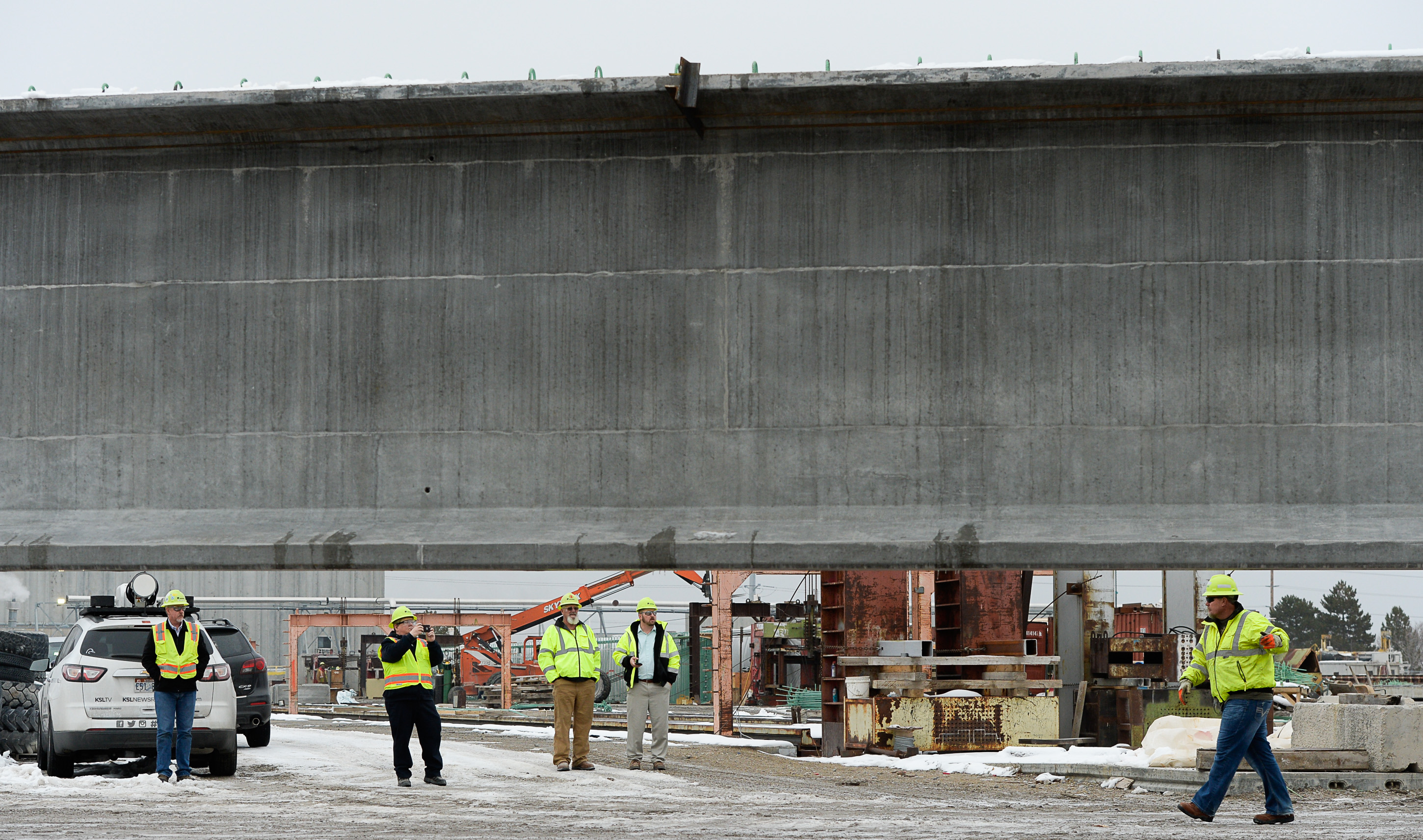 (Francisco Kjolseth | The Salt Lake Tribune) UDOT gets ready to place some of the world's largest-ever bridge beams, and the largest in Utah state history with a span of 203 ft long and just over 8 ft tall, as crews load one on a truck following manufacturing at Forterra Structural Precast in Kearns on Tuesday, Dec. 11, 2018. A total of six beams will be installed in the technology corridor in Lehi later this week.