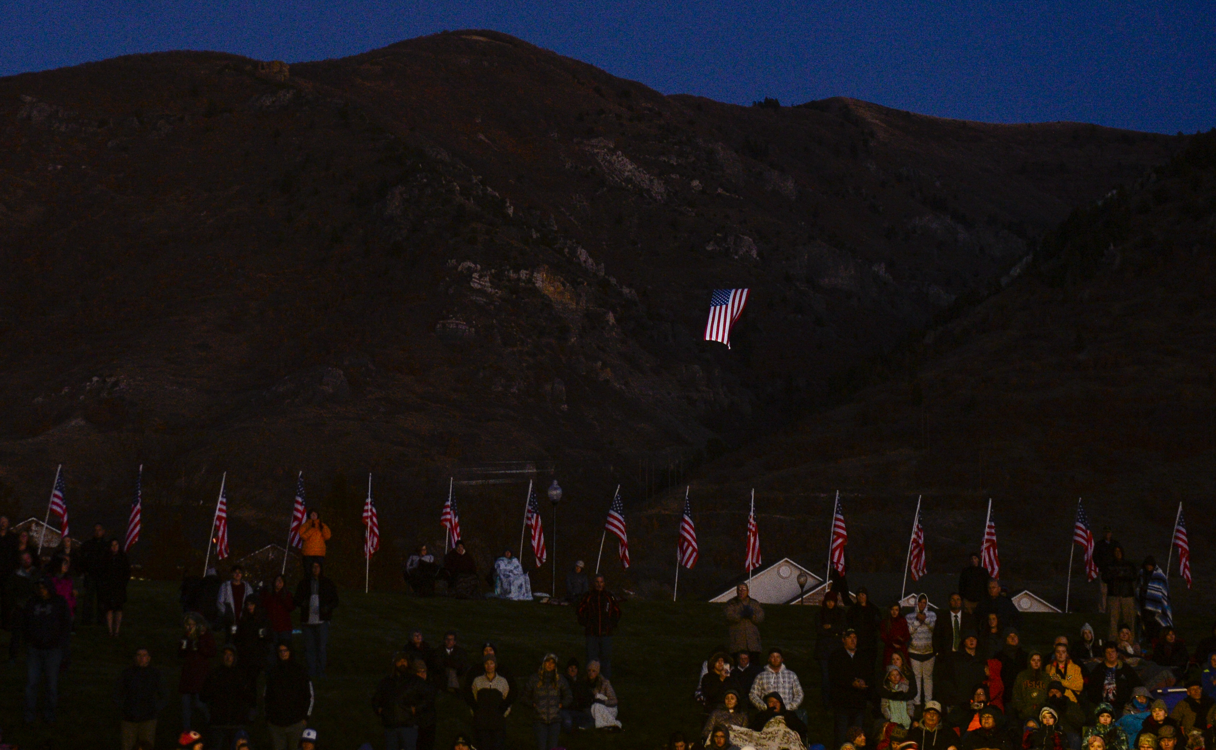 Leah Hogsten | The Salt Lake Tribune A gigantic American flag named "Betsy" flies above North Ogden during the Veteran's Day ceremony. Veterans, family members of active and retired military and patriotic supporters celebrated Veteran's Day at the Barker Park amphitheater in North Ogden with a memorial for North Ogden's hometown hero Army Major Brent Russell Taylor, who was killed in action on November 3, 2018, while training an Afghan Army commando battalion in Afghanistan. 