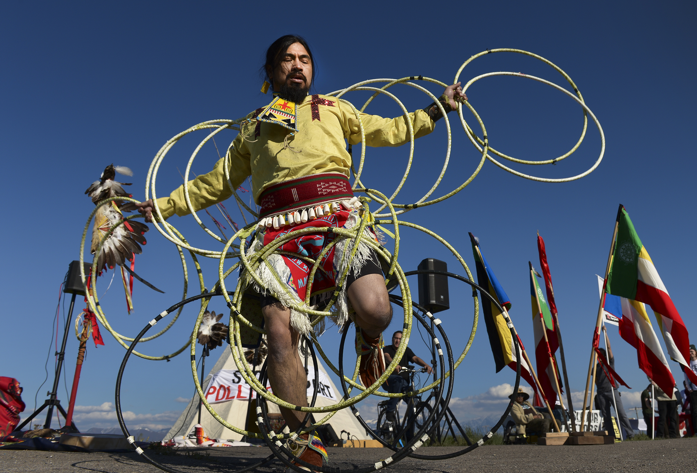 Leah Hogsten | The Salt Lake Tribune Carl Moore, a Hopi and Chemehuevi Native American performs a hoop dance in honor of Mother Earth. Moore also made offerings, sang and gave a prayer during the May Day celebration. The "Stop the Polluting Port" community coalition staged a May Day celebration, calling for respect and awareness of the water, earth and air regarding the 20,000 acres west of Salt Lake City where the inland port industrial site has been proposed.
