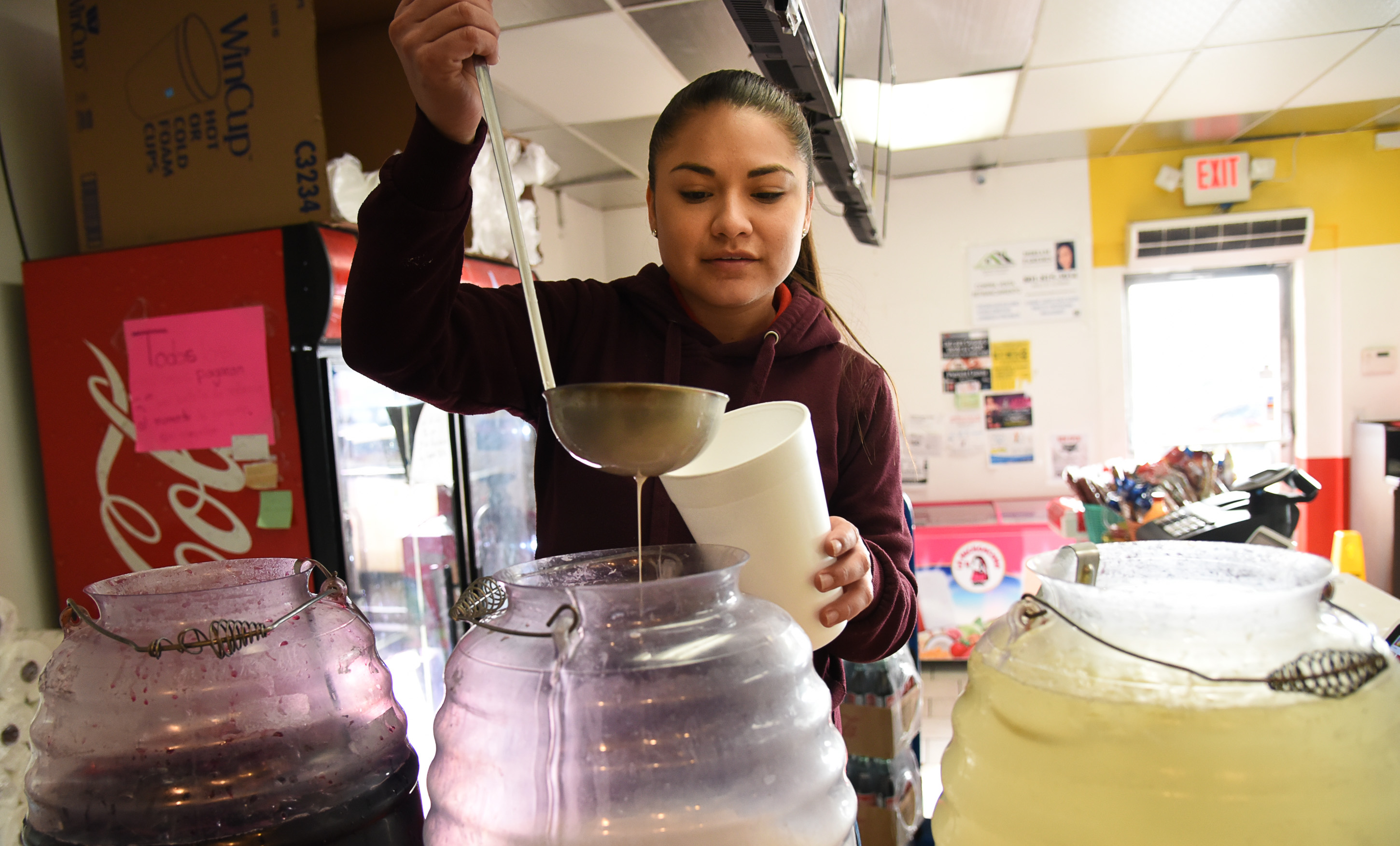 (Francisco Kjolseth | The Salt Lake Tribune) Sandy Vasquez fills drink orders of limeade, horchata and jamaica at Tacos Mi Caramelo, a late-night taqueria that is open until 2 a.m. most nights and 24-hours a day on Friday and Saturday in West Valley City.