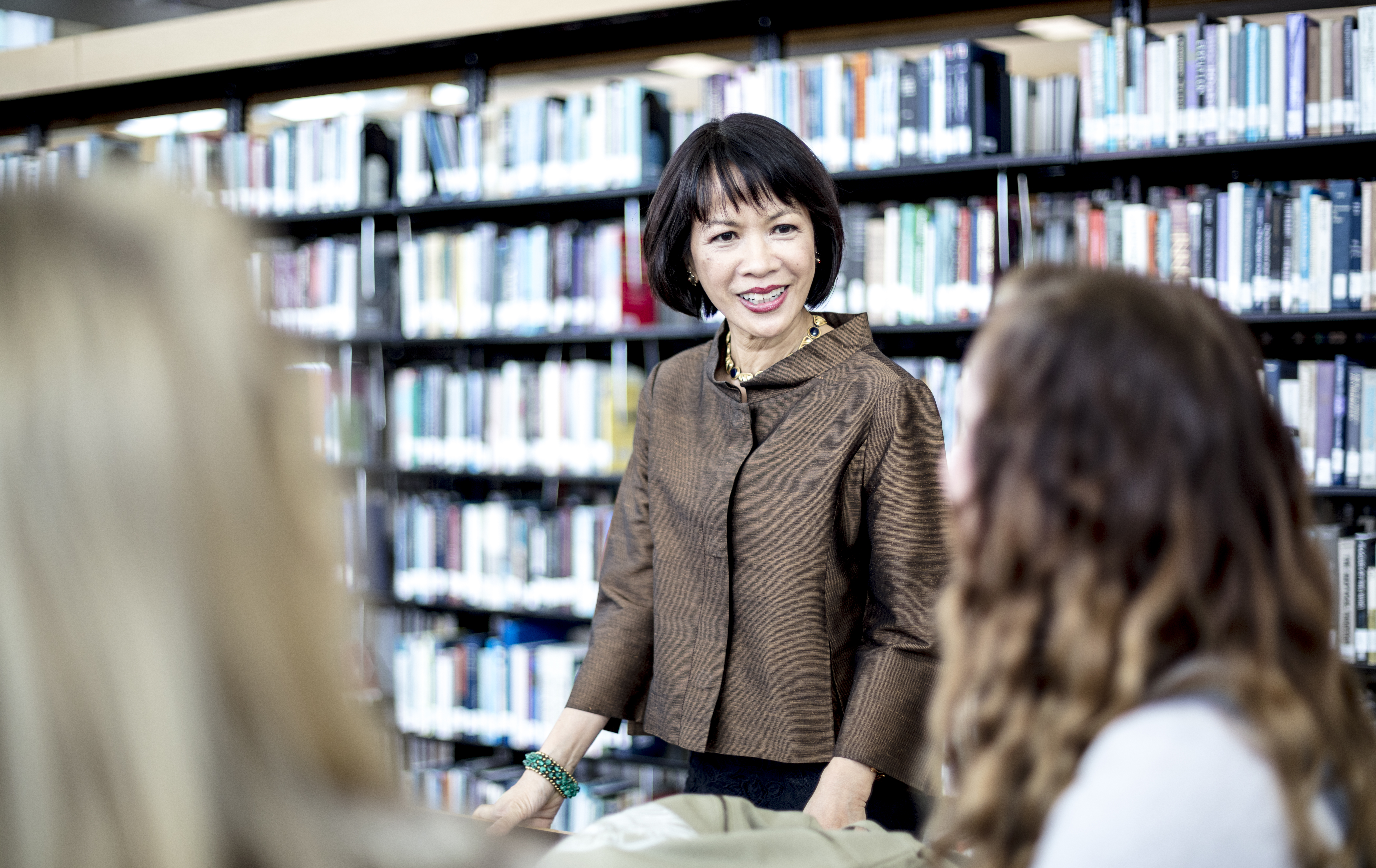 (Photo Courtesy of Jay Drowns/Utah Valley University) Utah Valley University President Astrid S. Tuminez, who was born in the Philippines, is photographed with students on the UVU campus in Orem, Utah on Wednesday, June 1, 2018.
