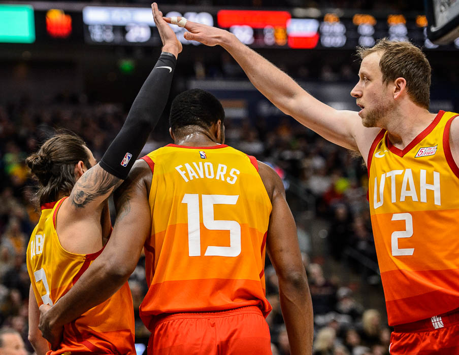 (Trent Nelson | The Salt Lake Tribune) Utah Jazz guard Ricky Rubio (3) and Utah Jazz forward Joe Ingles (2) high-five over Utah Jazz forward Derrick Favors (15) as the Utah Jazz host the San Antonio Spurs, NBA basketball in Salt Lake City on Saturday Feb. 9, 2019.