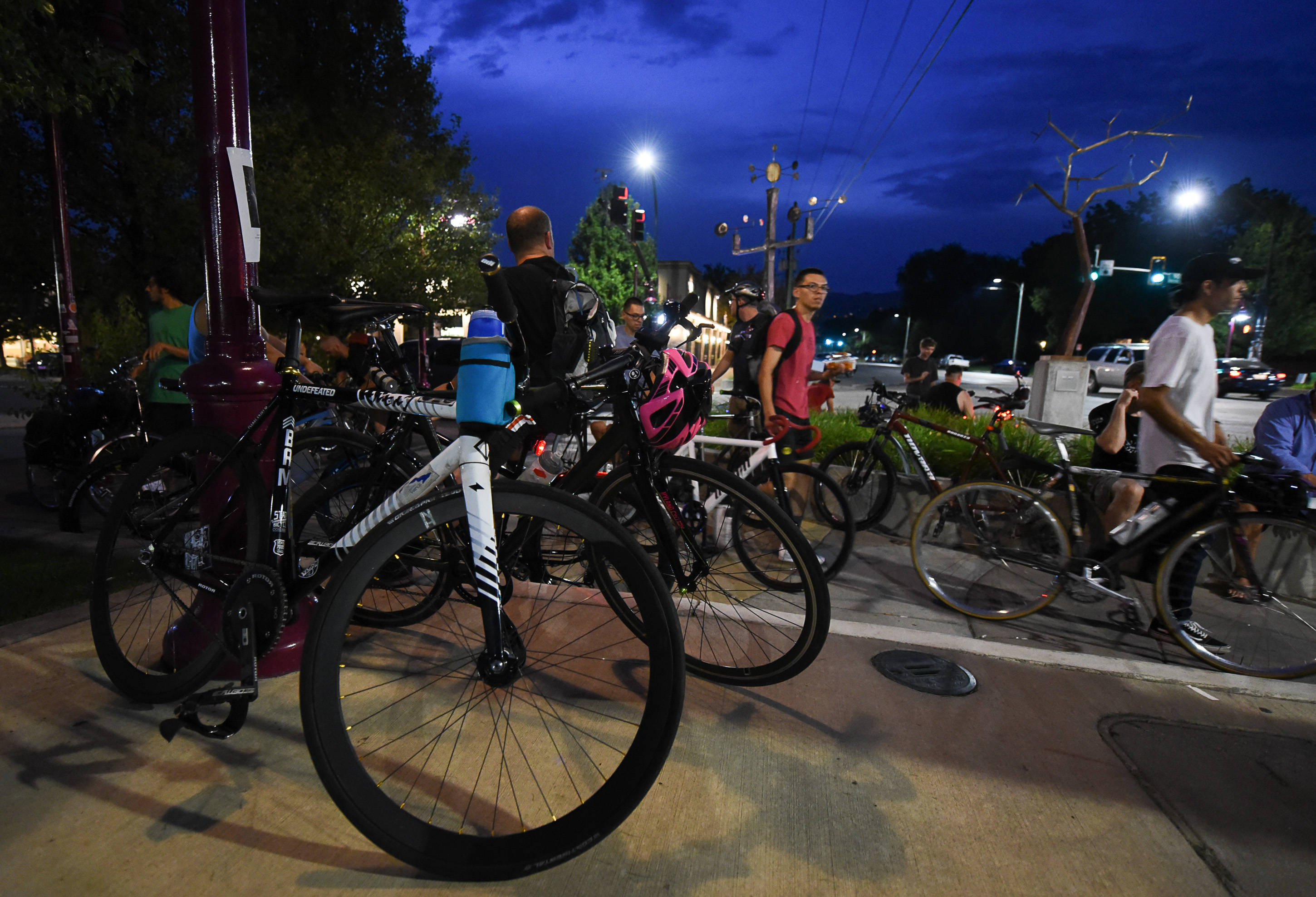 (Francisco Kjolseth | The Salt Lake Tribune) A large group of cyclist gathers on the corner of 9th and 9th at 9pm in Salt Lake City on Thursday, July 26, 2018, for the weekly ride that has become known as the 999 Ride. The inclusive, all-welcoming slow casual social ride happens year round on Thursday nights, with riders often pedaling into the early morning hours. Newly released video shows rider Cameron Hooyer being struck and killed by a FrontRunner train at a downtown railroad crossing during last weeks ride when the 22-year-old failed to stop or heed the warning signals before crossing the tracks during the group ride. 