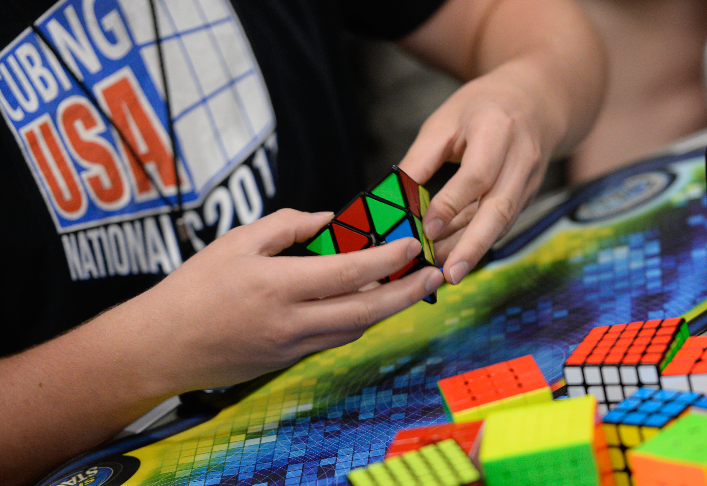 (Francisco Kjolseth | The Salt Lake Tribune) A young enthusiast works on his speed in solving a Pyraminx Puzzle during CubingUSA Nationals 2018 at the Salt Palace Convention Center in Salt Lake City on Saturday, July 28, 2018.