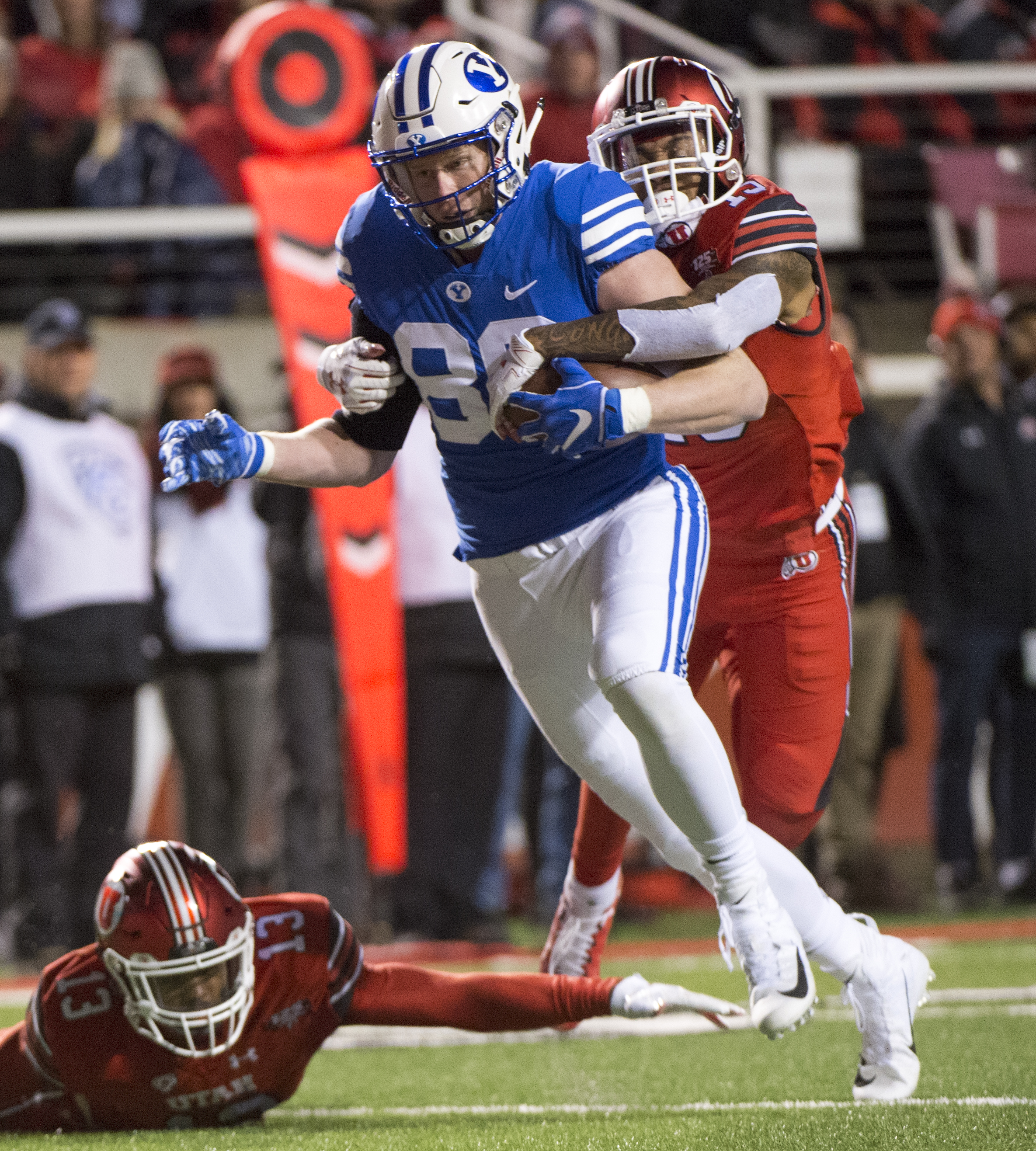 (Rick Egan | The Salt Lake Tribune) Brigham Young Cougars tight end Matt Bushman (89) gets past Utah Utes defensive back Marquise Blair (13) and Utah Utes defensive back Corrion Ballard (15) to score a touchdown for the Cougars, in football action between the Brigham Young Cougars and the Utah Utes, at Rice-Eccles Stadium, Saturday, November 24, 2018. 