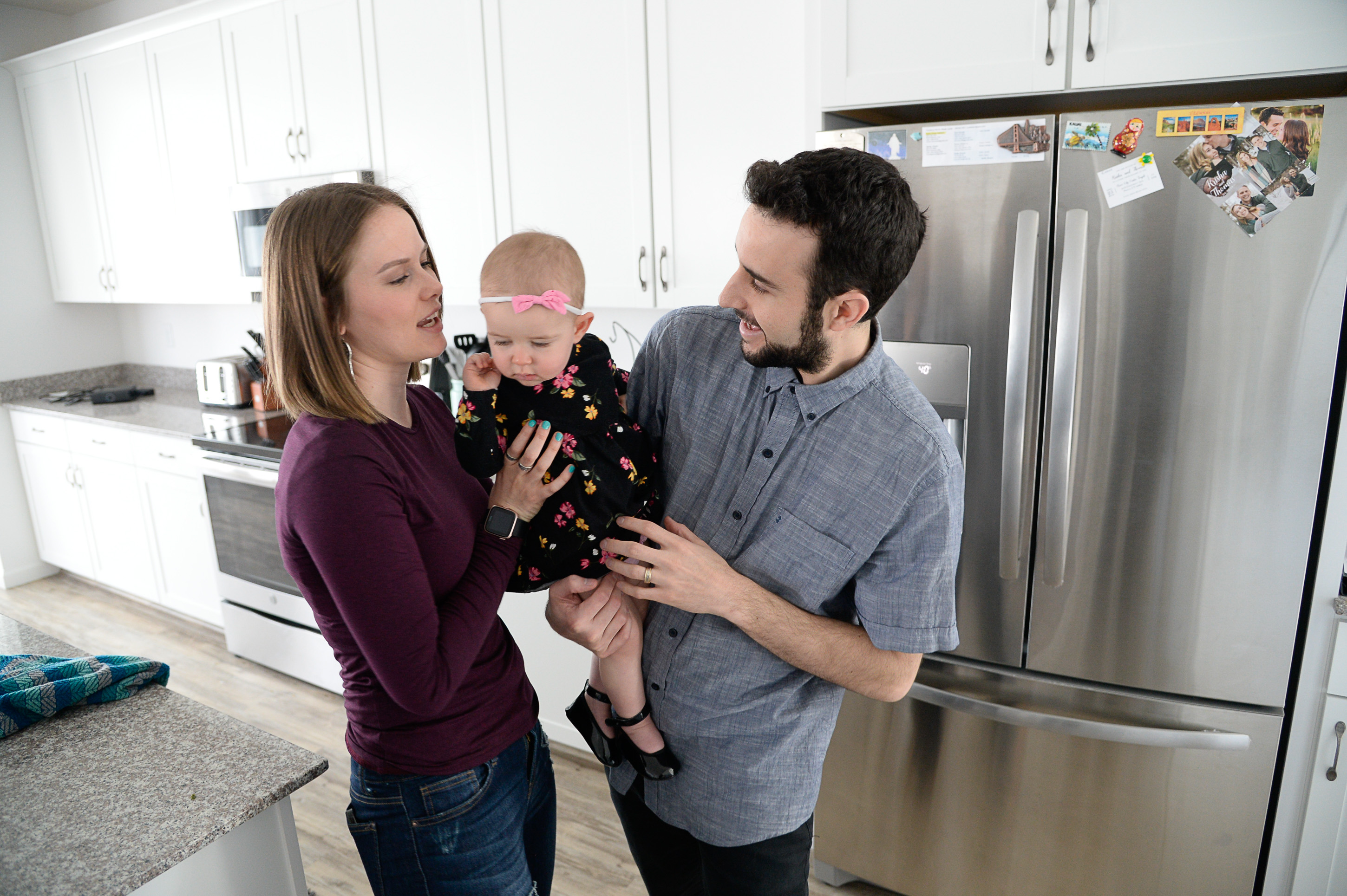 (Francisco Kjolseth | The Salt Lake Tribune) Ember and Jeremy Ulrich spend time with their daughter Jemma, 1, at their home in Lehi after moving from Pleasant Grove last October because they could get more house for their money there, and it's closer to Jeremy's job at Adobe in Lehi.