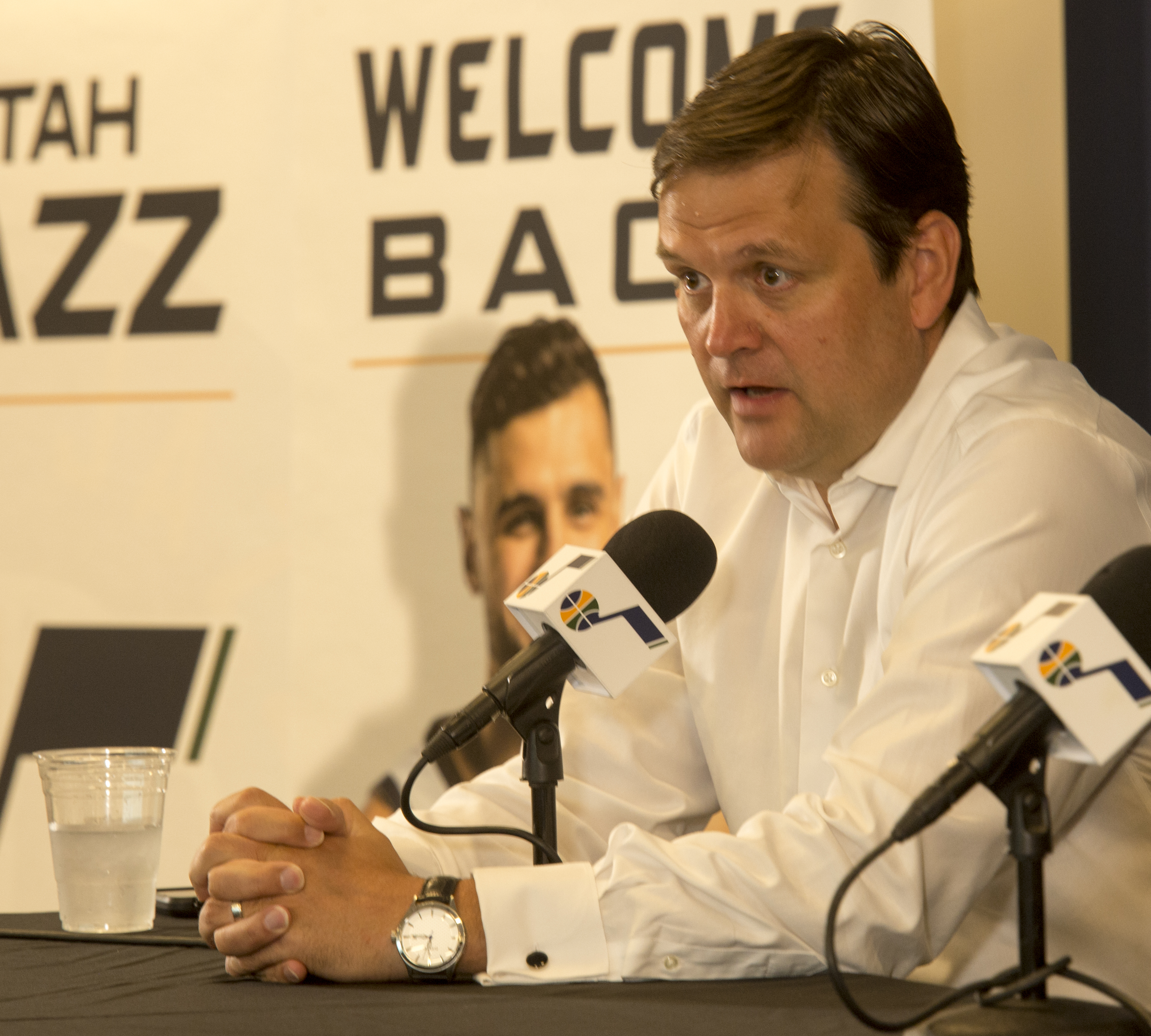 (Rick Egan | The Salt Lake Tribune) Dennis Lindsey talks about the re-signed free agents, Dante Exum, Derrick Favors and Raul Neto, at the Jazz practice facility, Friday, July 6, 2018. 