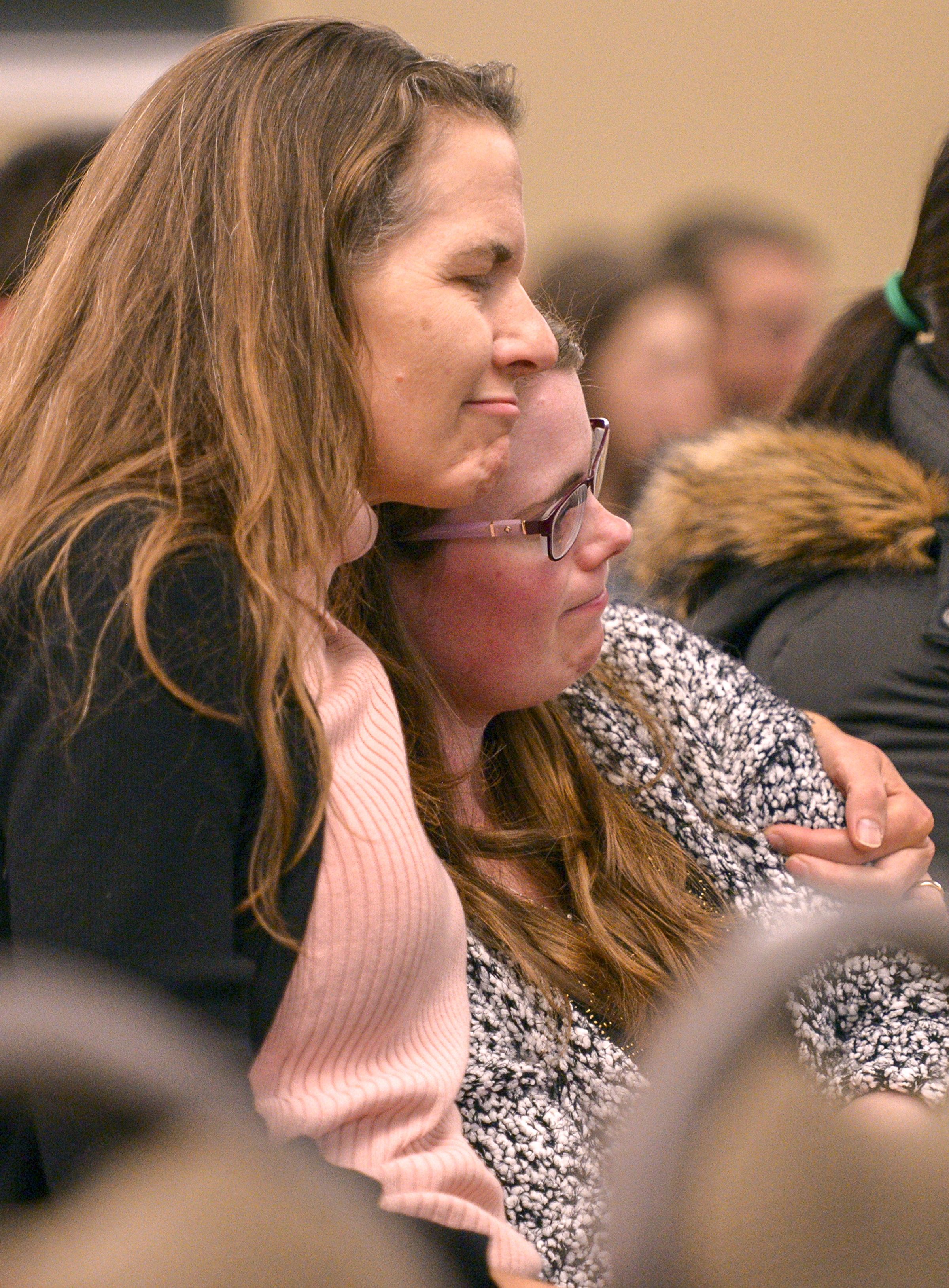 Leah Hogsten | The Salt Lake Tribune l-r Susan Cochella hugs Sara Walker as fellow medical interns and faculty recount stories and memories in the honor and memory of Sarah Hawley during the University of Utah's School of Medicine's candlelight vigil, Feb. 4, 2019. On Jan. 27, 2019 Salt Lake City police found 27-year-old physician Sarah Hawley and her boyfriend, Travis Geddes, dead at their Sugar House home. Geddes, 30, shot Hawley before killing himself.