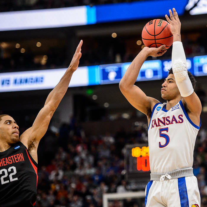 (Trent Nelson | The Salt Lake Tribune) Kansas Jayhawks guard Quentin Grimes (5) shoots over Northeastern Huskies guard Donnell Gresham Jr. (22) as Kansas faces Northeastern in the 2019 NCAA Tournament in Salt Lake City on Thursday March 21, 2019.