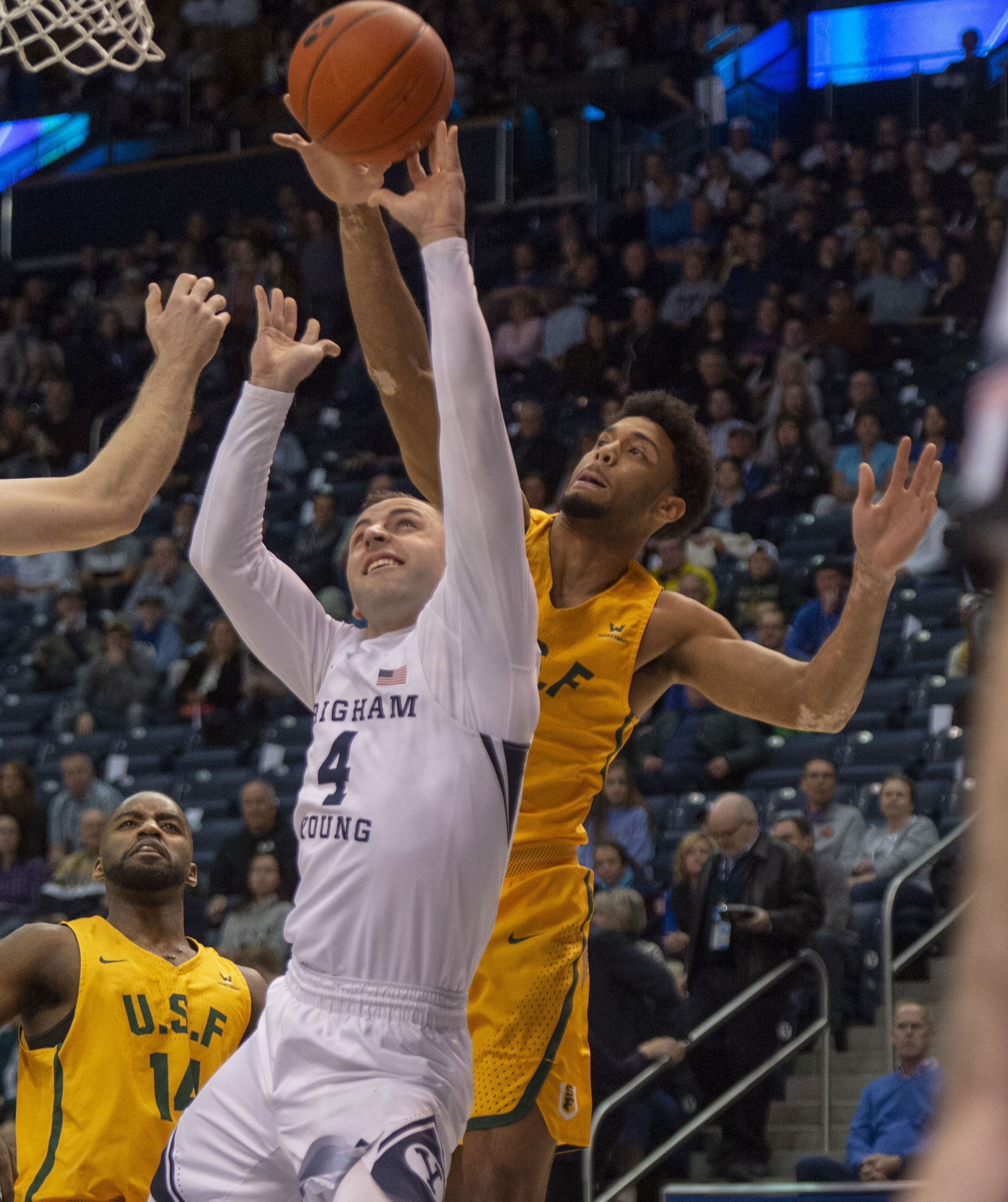 (Rick Egan | The Salt Lake Tribune) San Francisco Dons forward Nate Renfro (15) blocks a shot by Brigham Young Cougars guard Nick Emery (4), in WCC basketball action at the Marriott Center, Thursday, February 21, 2018. 