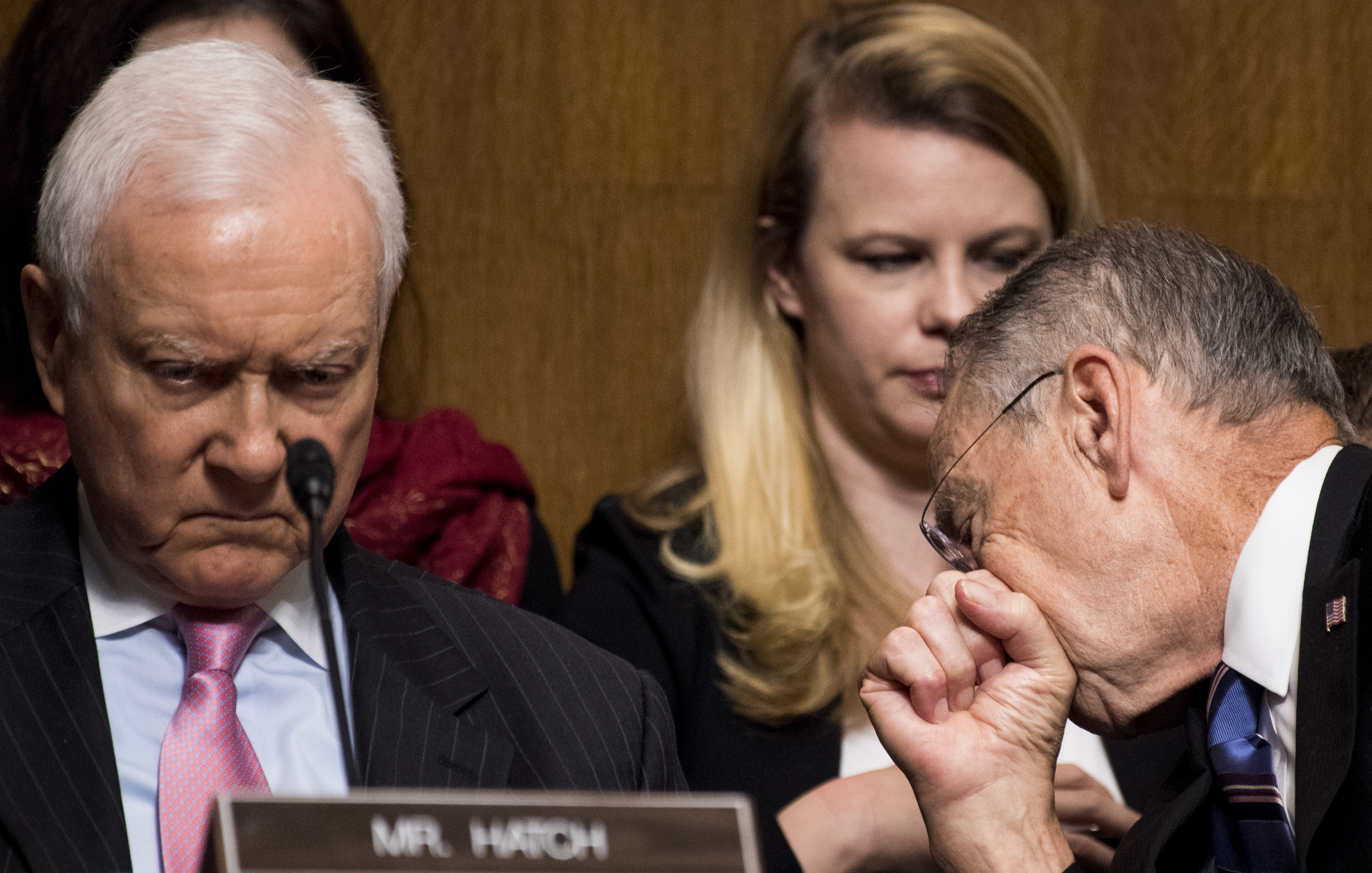 Sen. Orrin Hatch, R-Utah, left, listens to testimony from Christine Blasey Ford as chairman Chuck Grassley, R-Iowa, speaks with staff during the Senate Judiciary Committee hearing on the nomination of Brett M. Kavanaugh, Thursday, Sept. 27, 2018 on Capitol Hill in Washington. (Tom Williams/Pool Image via AP)