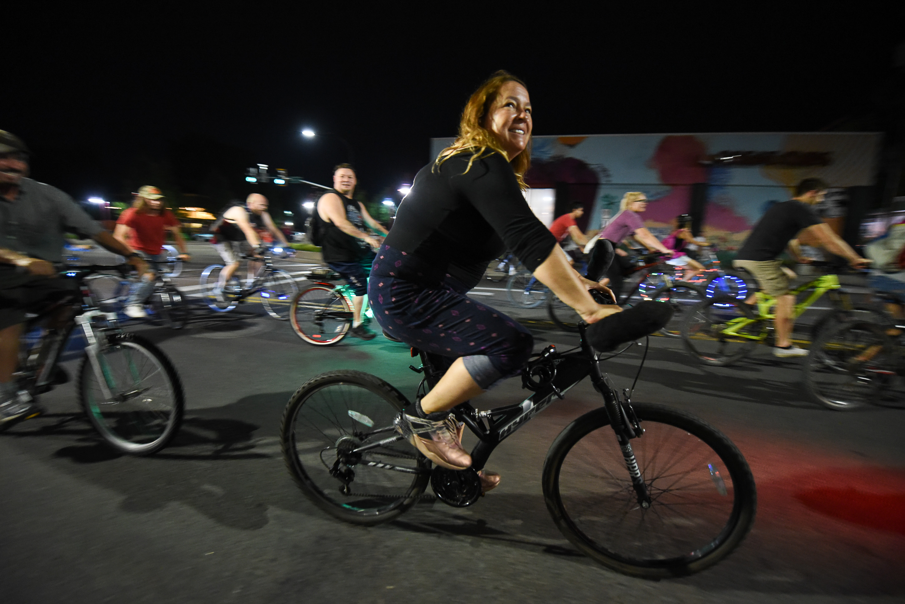 (Francisco Kjolseth | The Salt Lake Tribune) A large group of cyclist begins their ride from the corner of 9th and 9th after gathering after 9pm in Salt Lake City on Thursday, July 26, 2018, for the weekly ride that has become known as the 999 Ride. The inclusive, all-welcoming slow casual social ride happens year round on Thursday nights, with riders often pedaling into the early morning hours. Newly released video shows rider Cameron Hooyer being struck and killed by a FrontRunner train at a downtown railroad crossing during last weeks ride when the 22-year-old failed to stop or heed the warning signals before crossing the tracks during the group ride. 